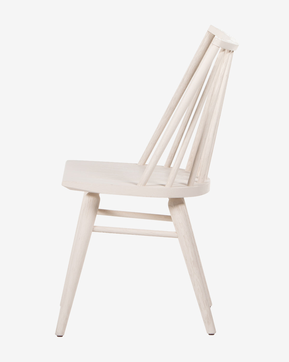 Side view of the Madison Dining Chair, a minimalist oak design with a flat seat, angled backrest with vertical slats, and four tapered legs in a light natural wood finish, by McGee & Co.