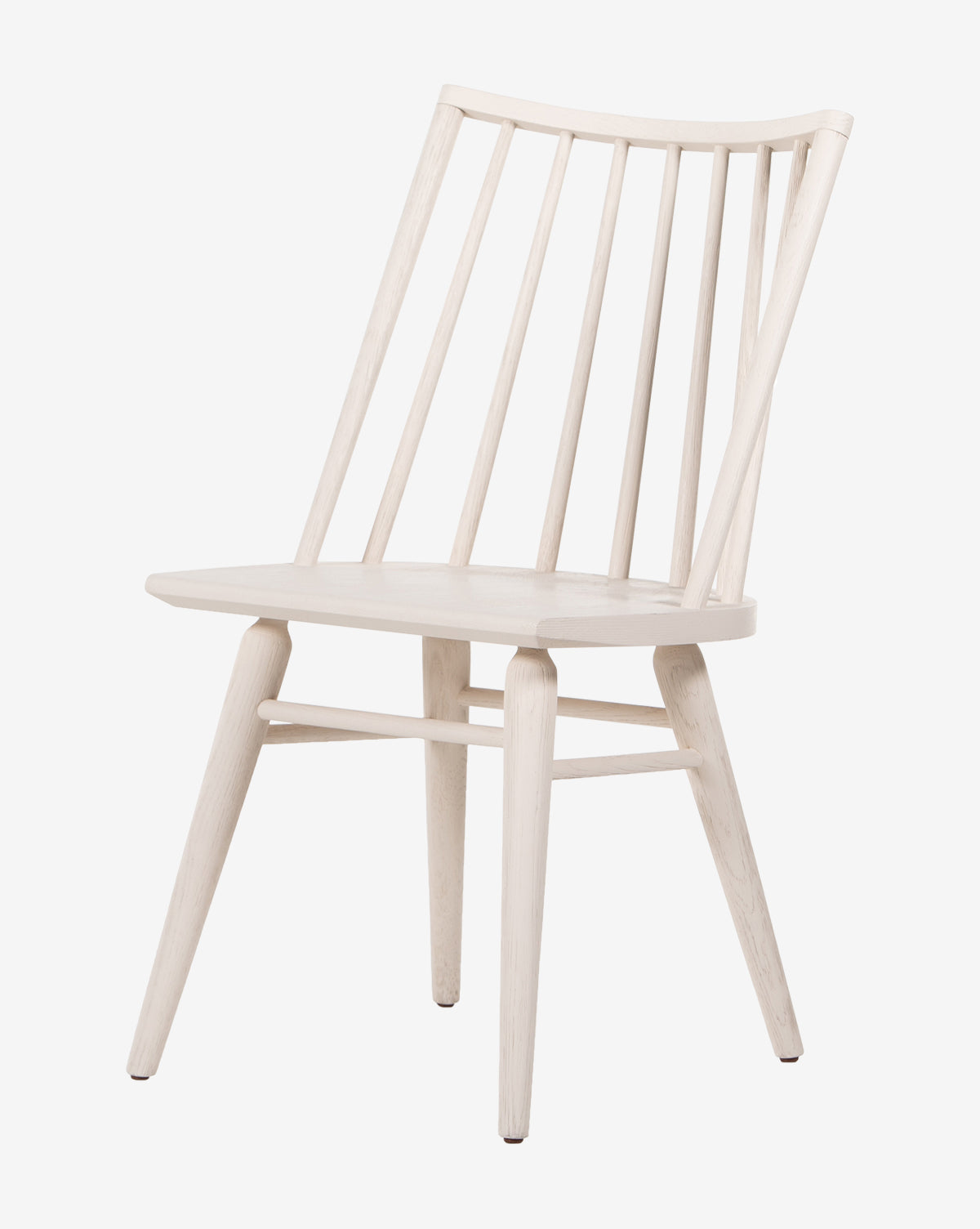 The Madison Dining Chair is a wooden Windsor-style seat with a light finish, curved backrest with vertical slats, and four angled legs, by McGee & Co. Its design is simple and minimalist.