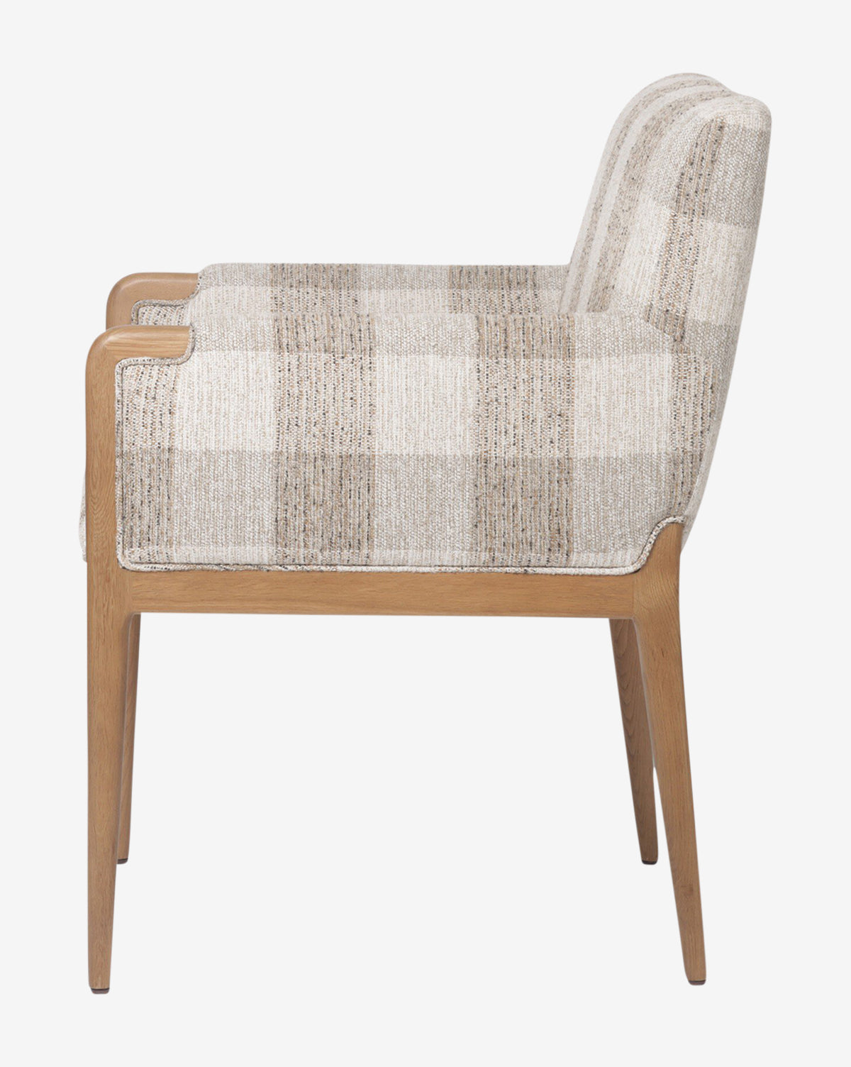 Side view of the Maebh Dining Chair, showcasing modern oak design with light wood legs and armrests, timeless style, and beige plaid upholstery on the seat and backrest, set against a plain white background, by McGee & Co.