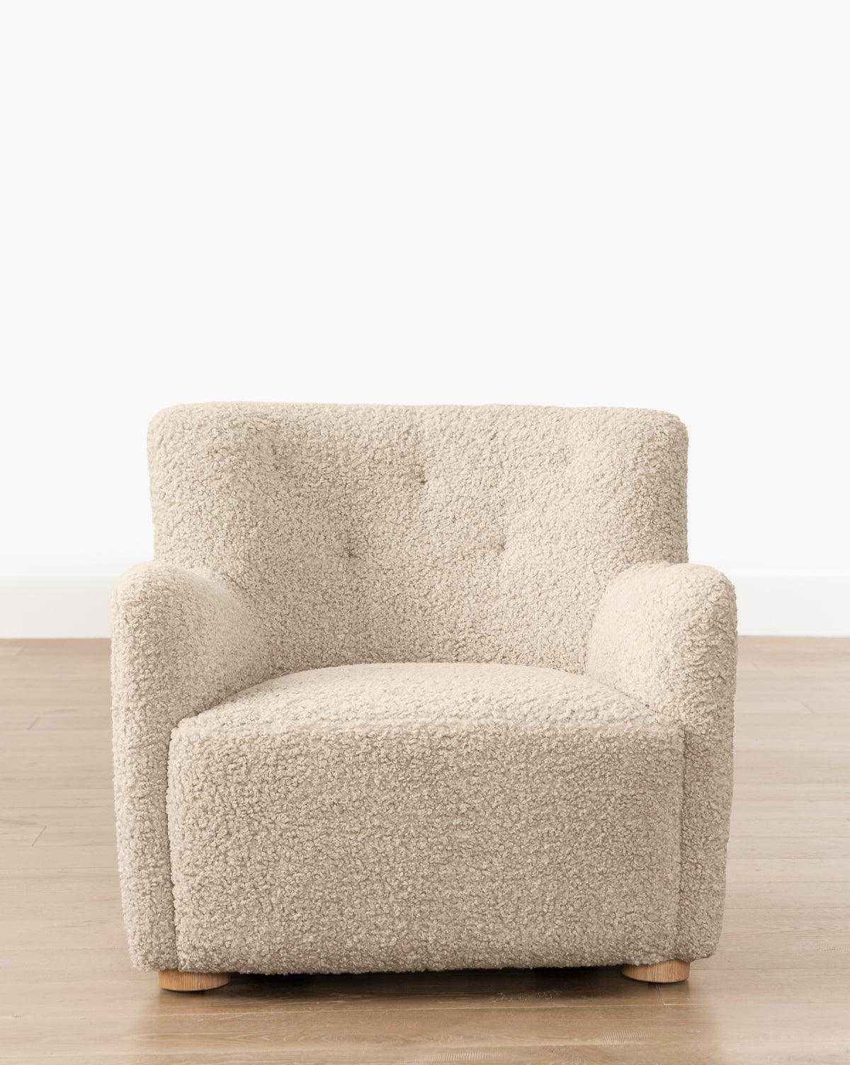 The Magda Lounge Chair (Ready to Ship) features a plush light beige boucle fabric, square design, wooden feet, and a button-tufted backrest—offering modern comfort for any living space, by McGee & Co.