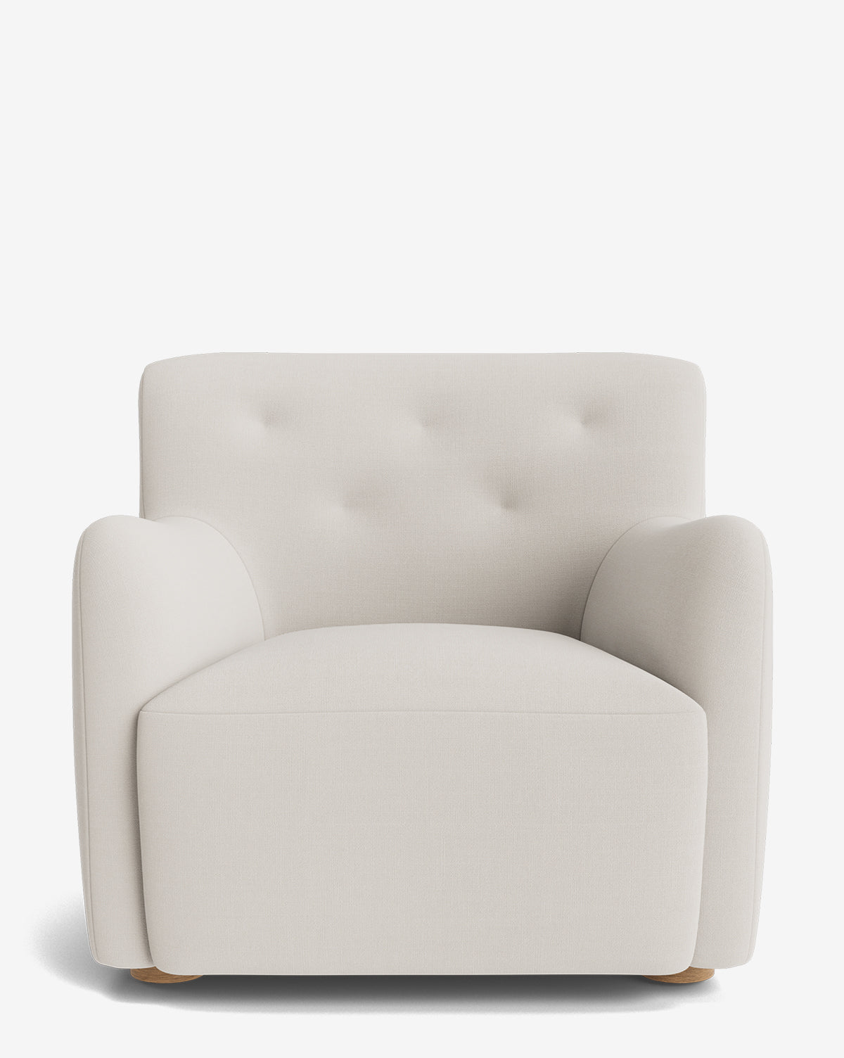 The Magda Lounge Chair is a modern, oversized seat with soft light beige designer fabric, a tufted backrest, rounded arms, and short wooden legs, displayed against a plain white background by McGee & Co.