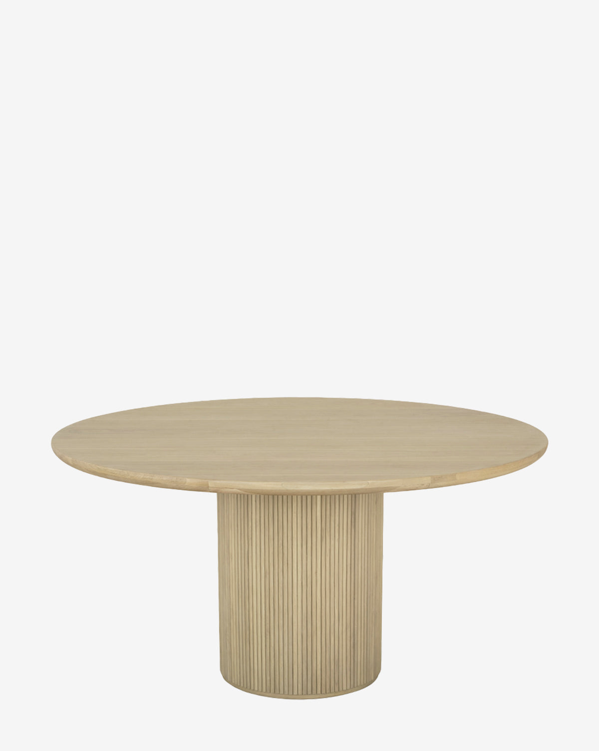 The Manderson Dining Table is a round, light oak table with a smooth top and wide cylindrical pedestal base accented by elegant vertical grooves, shown against a plain white background by McGee & Co.