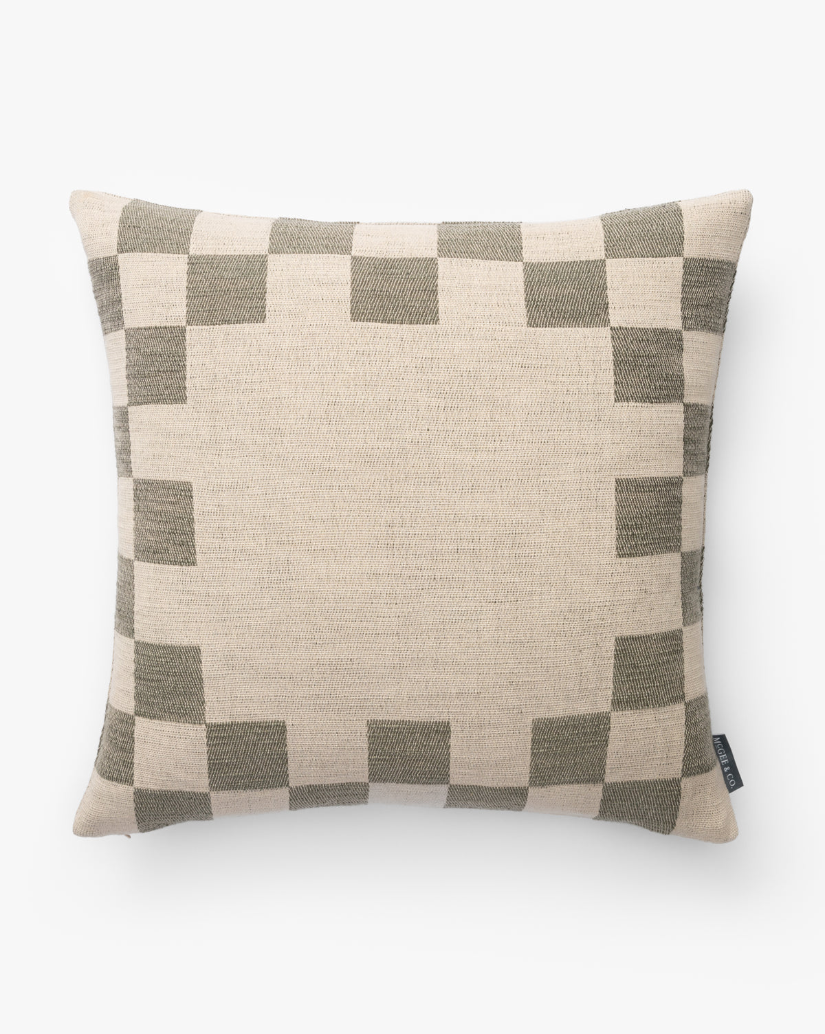 The Marni Pillow Cover is a square beige cotton cover with a geometric dark olive green square border framing its white background, creating a simple, modern design by McGee & Co.