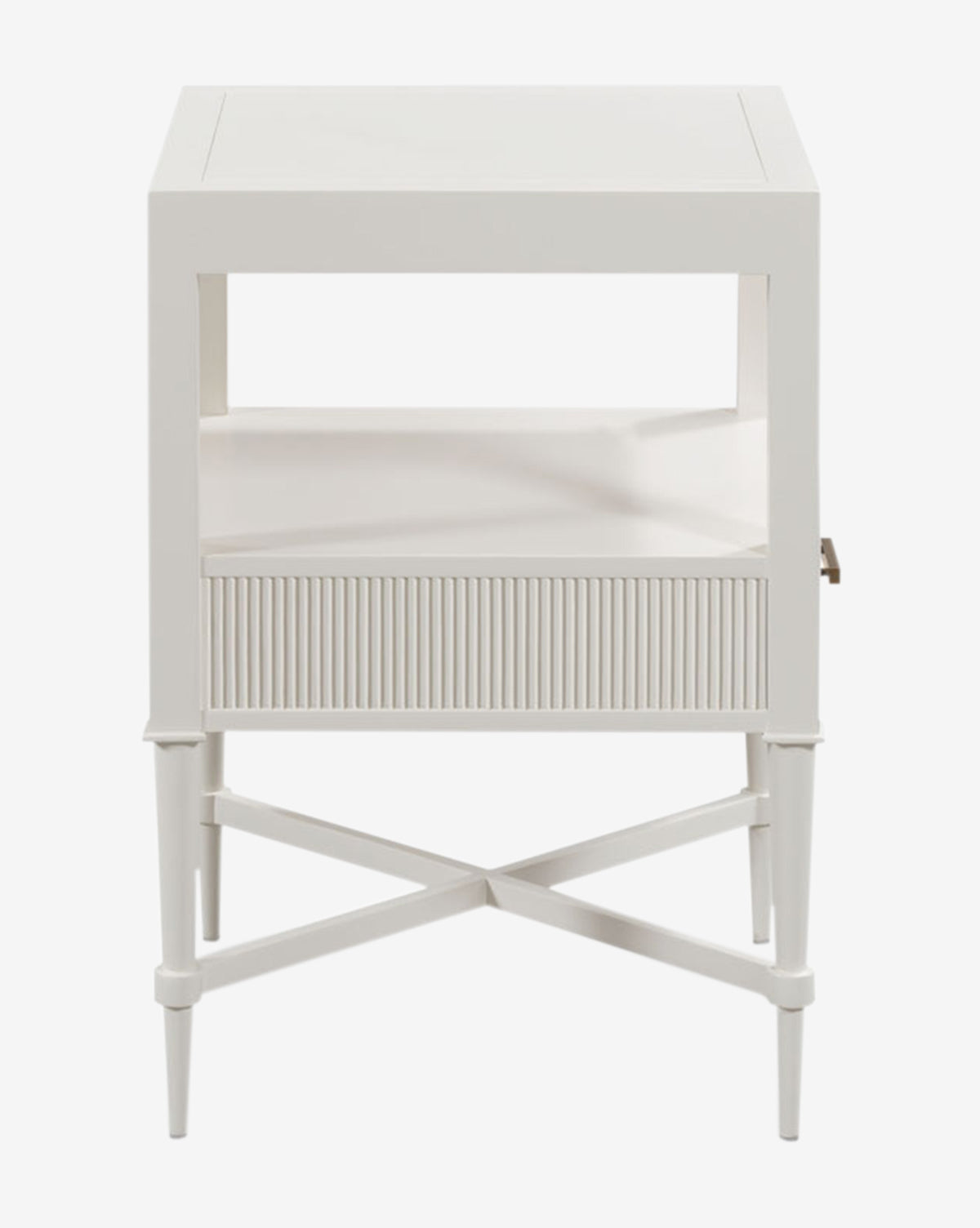 The Martinez Nightstand showcases a modern white finish, tapered legs, an open shelf, and a reeded drawer front with elegant brass hardware and minimal lines for a sleek, contemporary look, by McGee & Co.