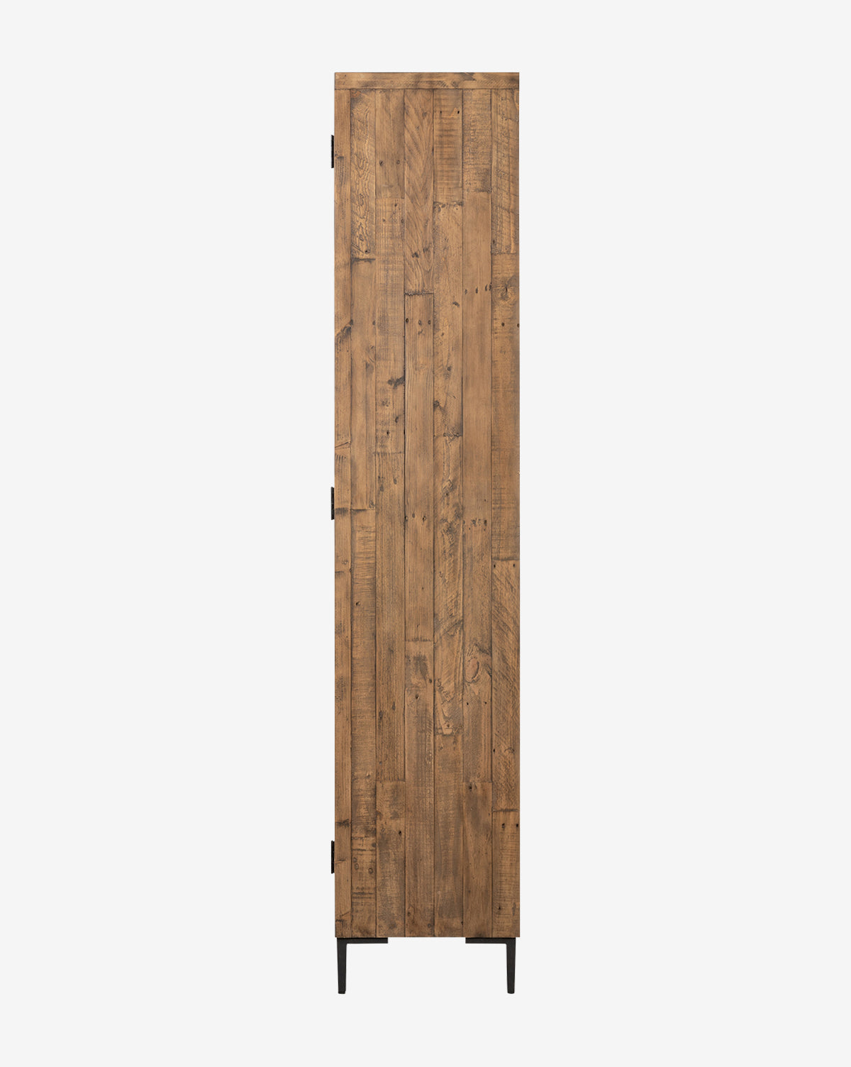 The Maverick Cabinet, a tall and narrow piece made from reclaimed pine with a rustic finish, features iron hardware and black metal legs, by McGee & Co.