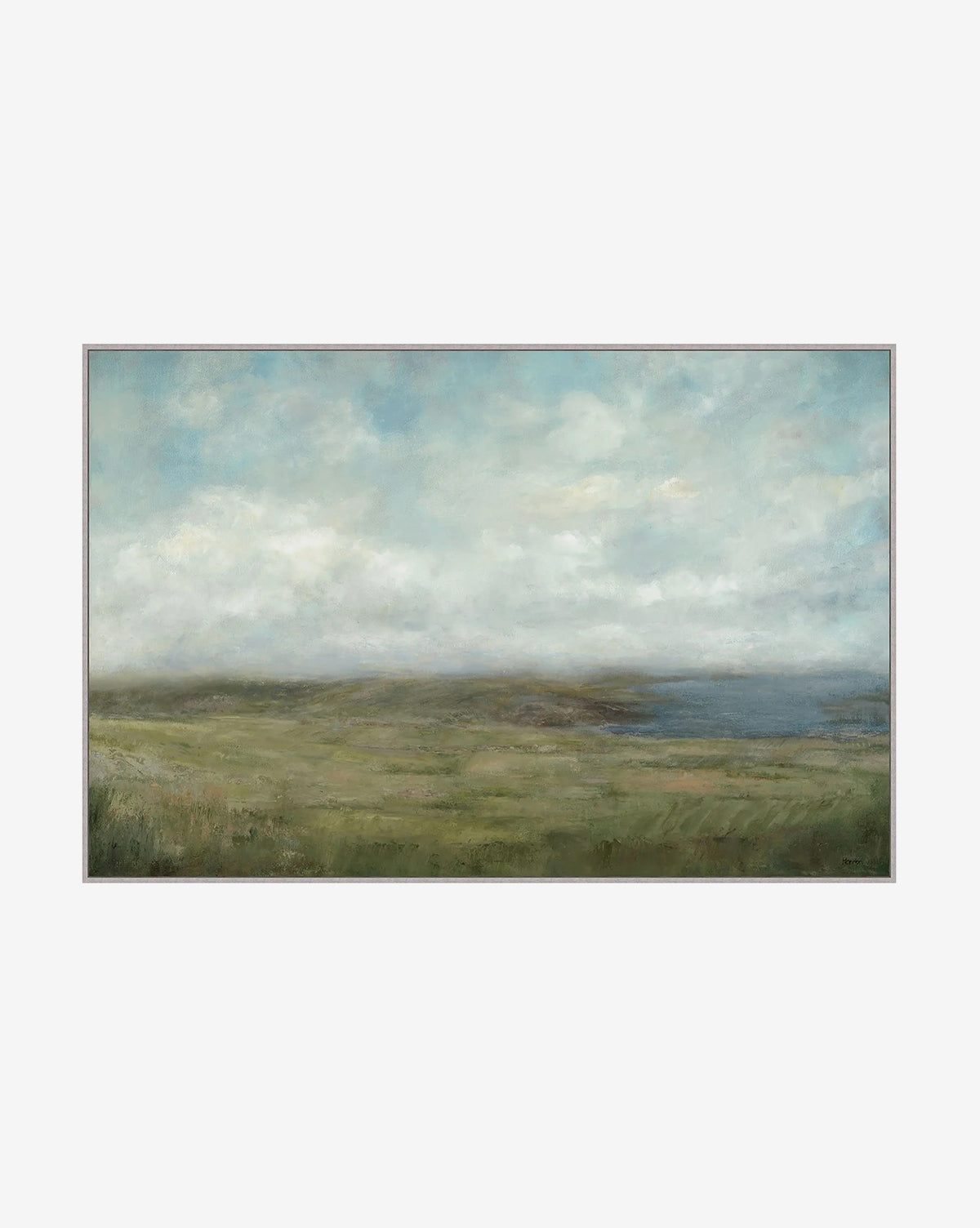 Meadow Vista by Patricia Perron features a tranquil coastal scene with a cloudy sky, lush green field, and distant blue water. This giclée print’s soft tones make it ideal for calming home décor, by McGee & Co.