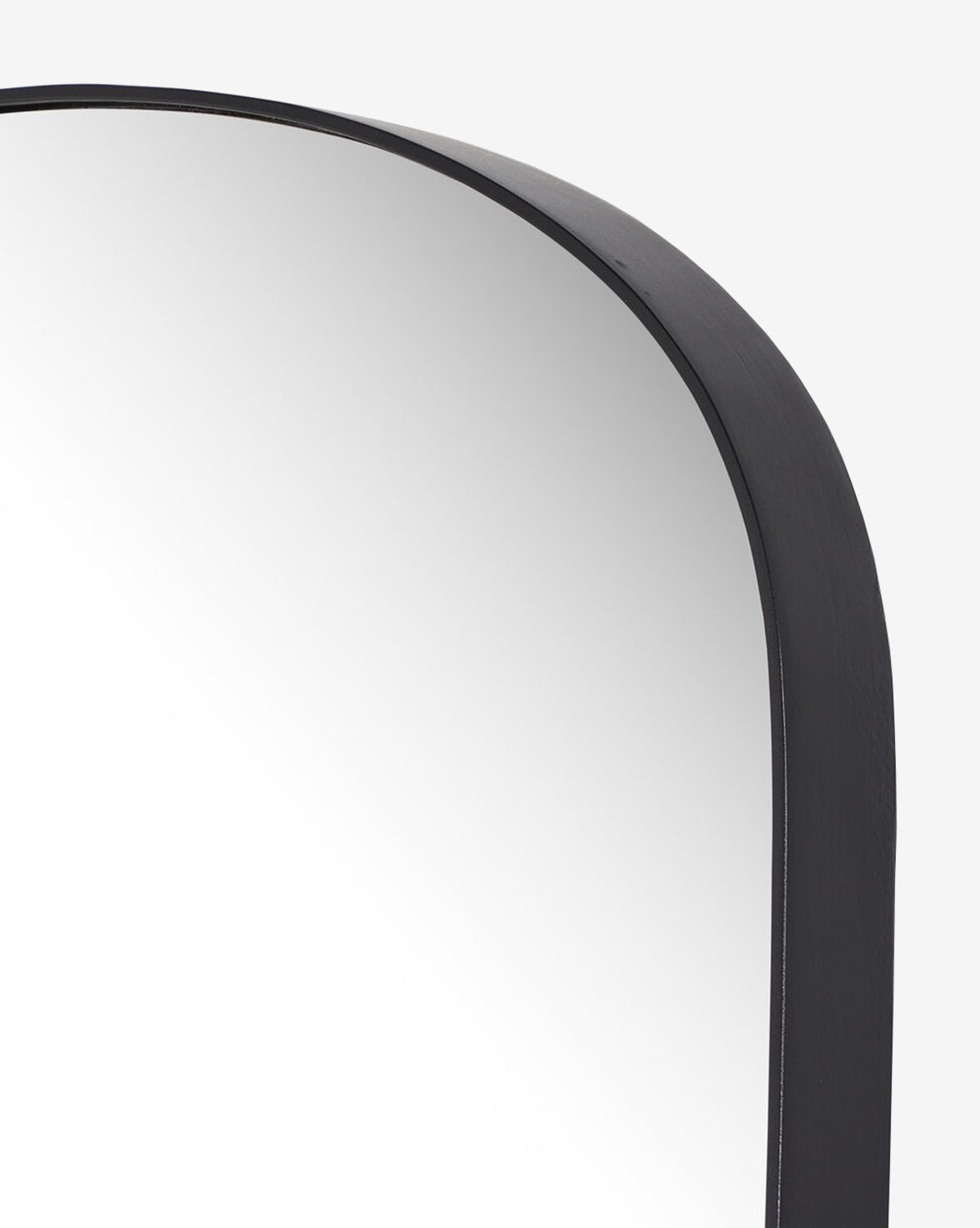 Close-up of the top right corner of the Meera Iron Mirror, showcasing its thick, modern iron frame with rounded edges against a plain white background—ideal as contemporary wall art, by McGee & Co.