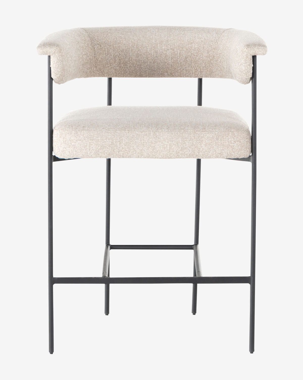 Front view of the Monson Stool, a modern bar stool with a light beige upholstered seat and backrest, thin black metal legs, and a rectangular footrest, by McGee & Co.