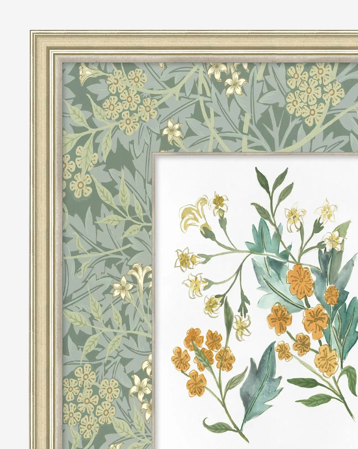 A close-up of Morris Icon II, a gallery-quality framed botanical artwork showcasing yellow and orange flowers with green leaves. Its border features pale yellow blooms and green foliage on a muted green background, by McGee & Co.