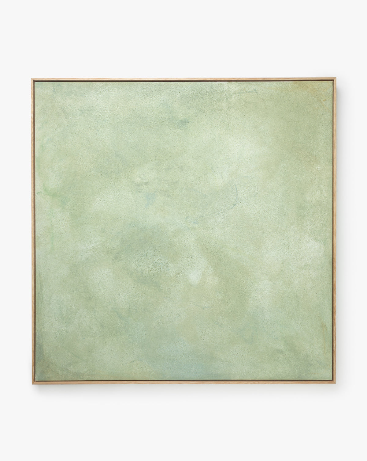Moss is a large rectangular abstract giclee print featuring a soft, muted green and light beige textured surface, framed in natural wood and set against a white background.