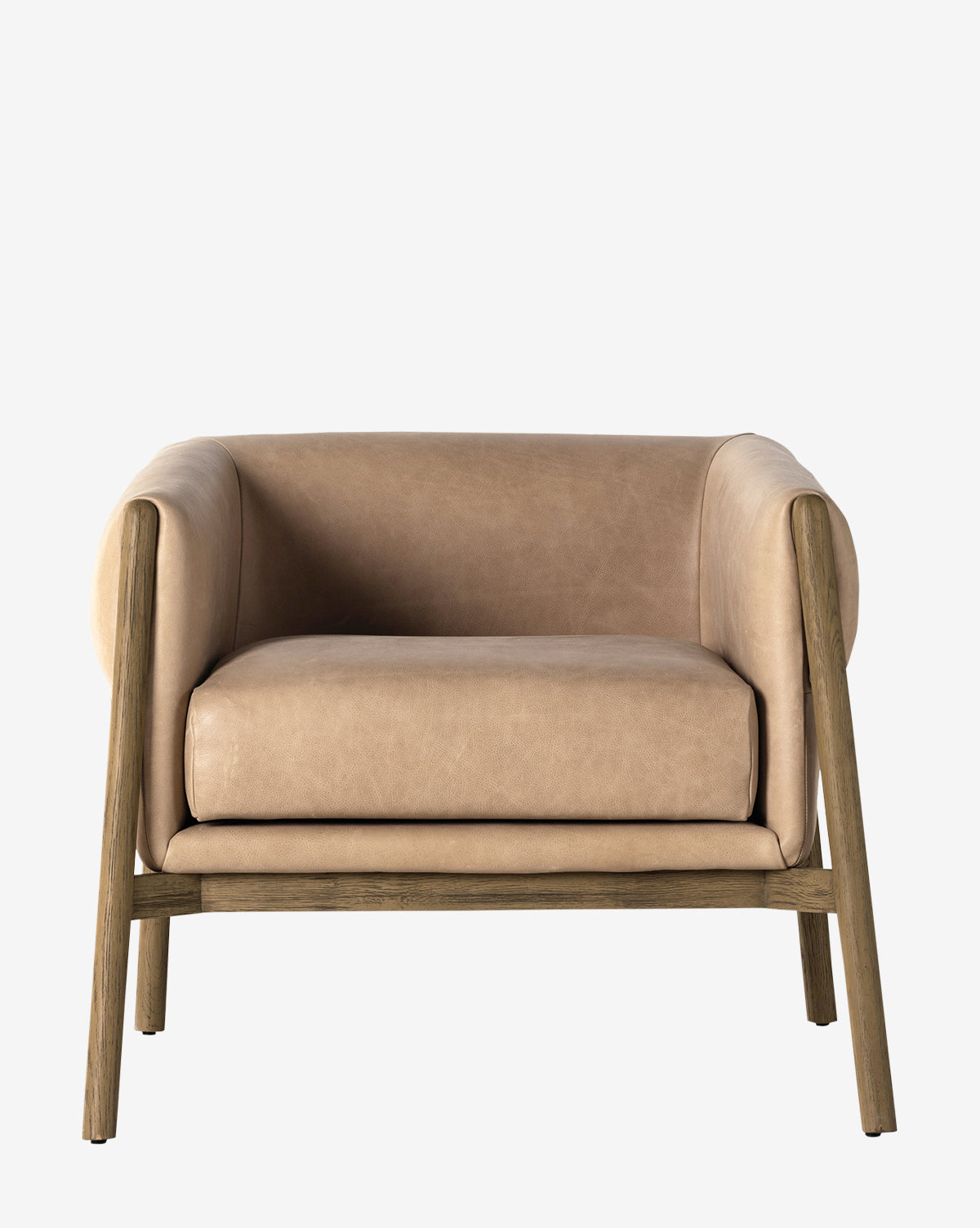 The Nadine Lounge Chair features tan leather upholstery, a plush gray cushion, and a solid oak frame with angled legs, displayed against a plain white background by McGee & Co.
