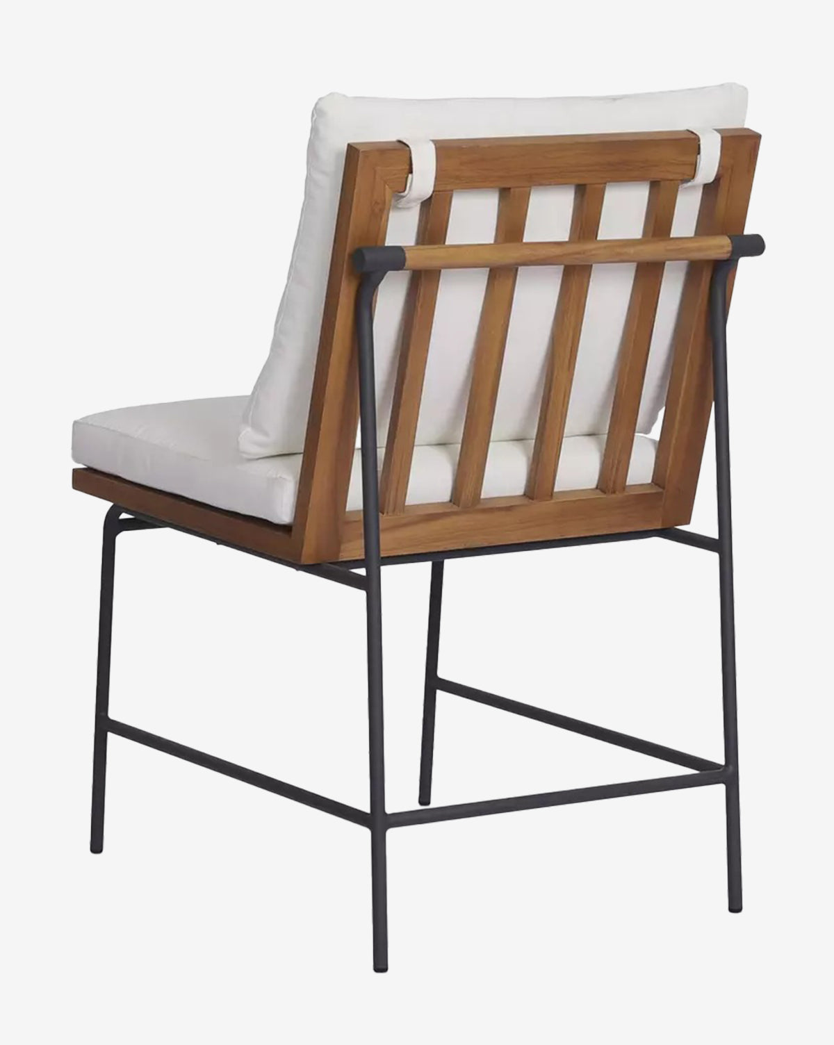 The Neal Outdoor Dining Chair features a teak frame, slatted wood backrest, white performance fabric cushions, and black metal legs, shown from a rear side angle by McGee & Co.