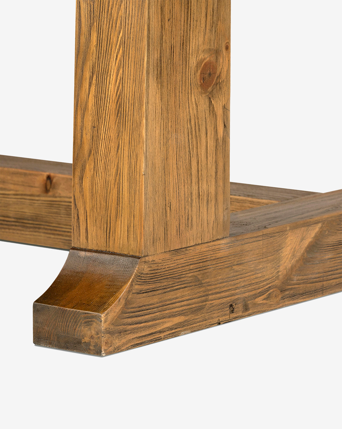 Close-up of the base and leg of the Niran Extension Dining Table, crafted from solid pine, showcasing its natural grain, knots, smooth finish, and sturdy rectangular support structure against a white background by McGee & Co.
