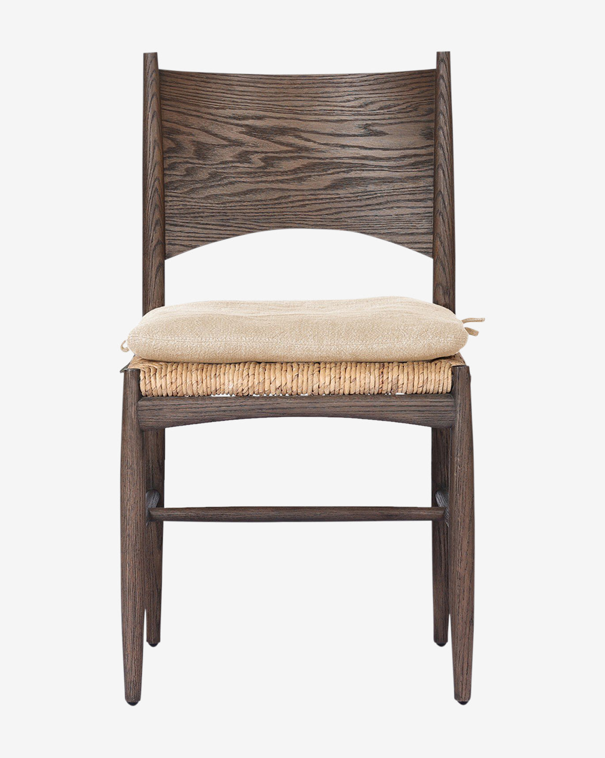 The Nixie Dining Chair features dark solid oak, a woven banana leaf seat, and a light high-performance fabric cushion, shown against a plain white background by McGee & Co.
