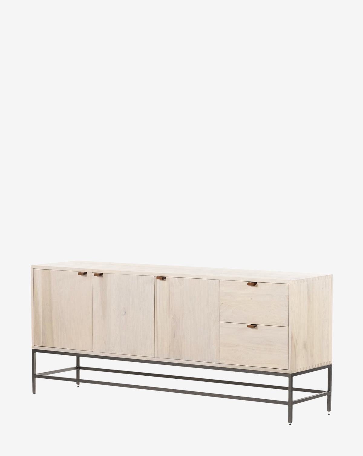 The Noland Sideboard is a modern piece with light wood, two left doors for hidden storage, two drawers and a right door, all set on slim black metal legs and frame, displayed against a white background by McGee & Co.