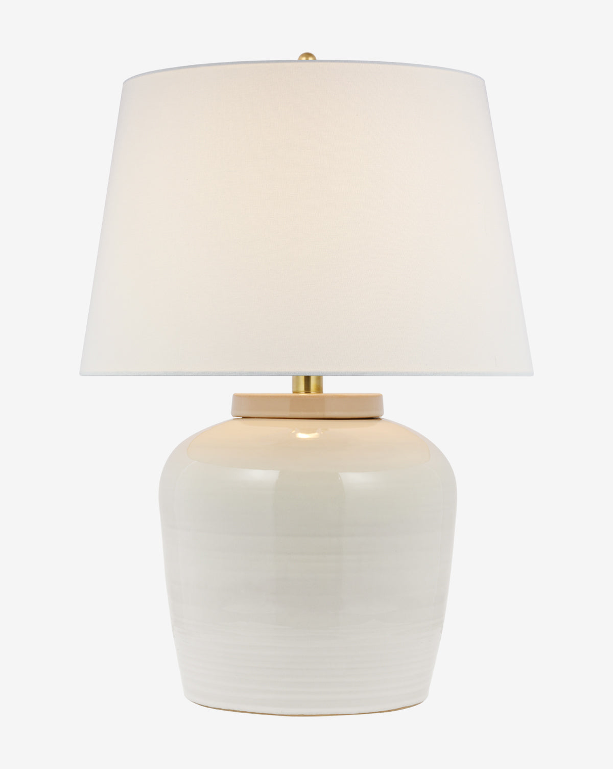 The Nora Table Lamp features a glossy light beige ceramic base and a wide white linen shade, shown against a plain white background by McGee & Co.