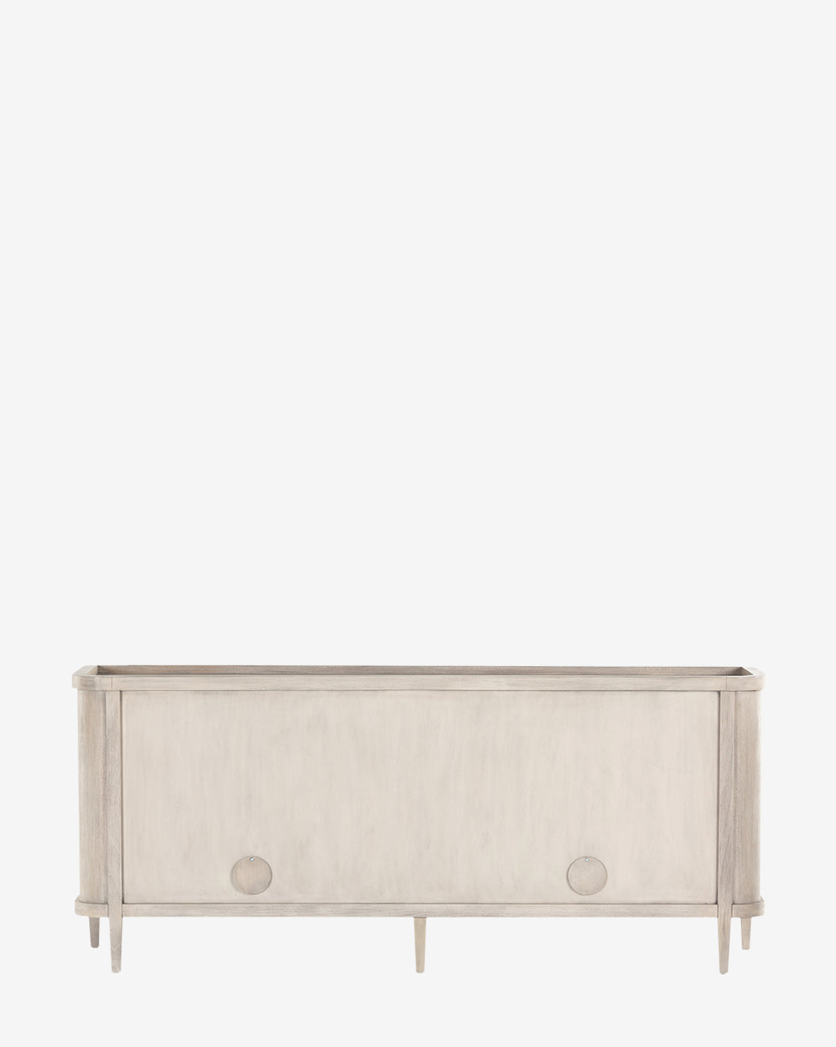 The Nyx Sideboard is a minimalist, solid mahogany piece with adjustable shelves, four tapered legs, and round front handles, shown on a plain white background by McGee & Co.