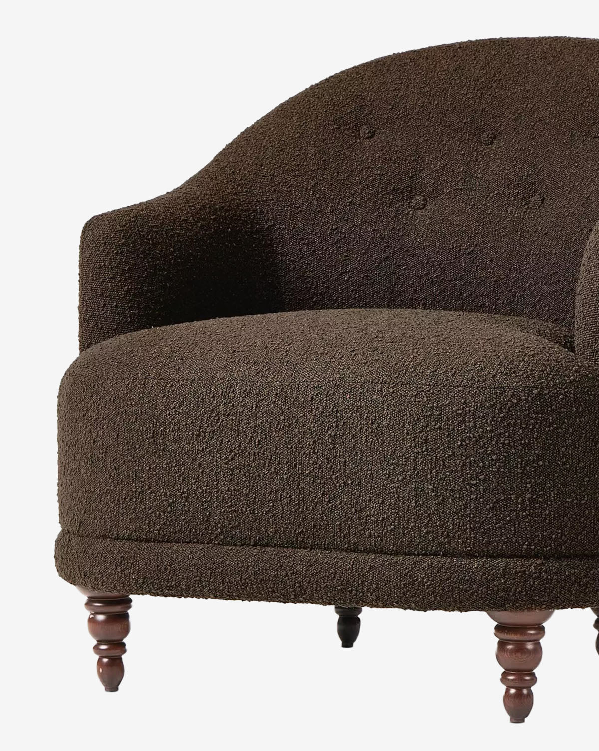 A close-up of the Olivette Slipper Chair showcases its dark brown, textured upholstery, curved armrests, rounded back, and wooden turned legs—capturing the elegance of traditional modern design, by McGee & Co.