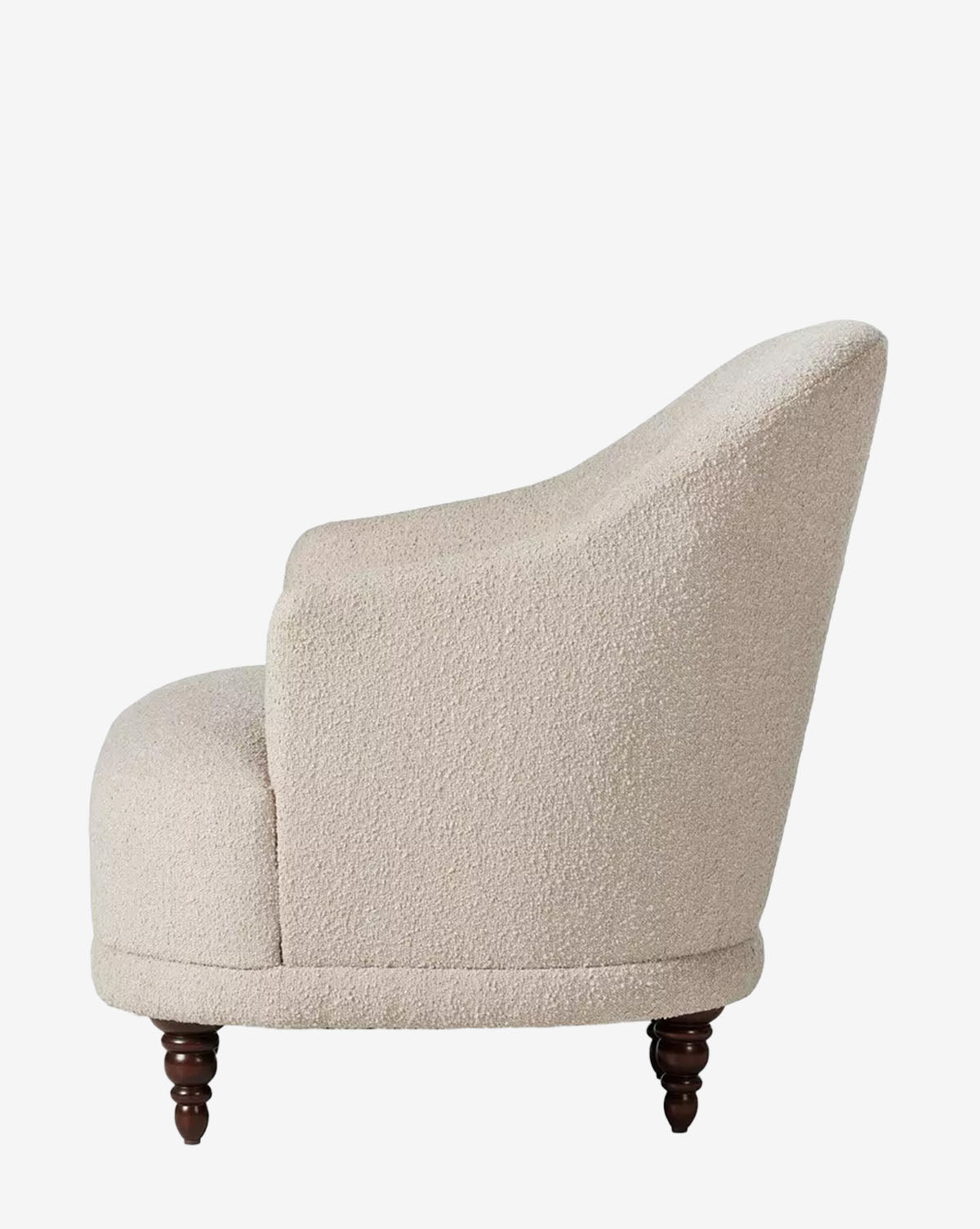 Side view of the Olivette Slipper Chair, featuring plush beige velvet upholstery with a textured finish and four short dark wood legs, set against a plain white background, by McGee & Co.