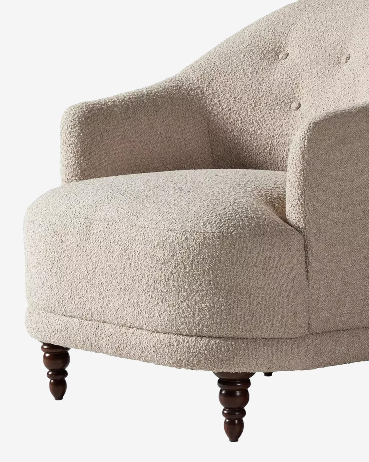 The Olivette Slipper Chair showcases modern style with cream textured fabric, a rounded seat, curved backrest, and dark wood legs, by McGee & Co.
