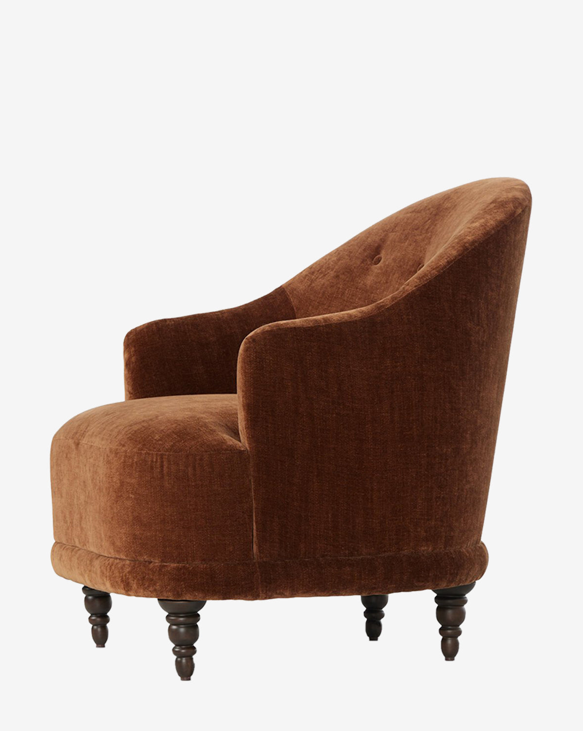 The Olivette Slipper Chair features plush brown velvet, a rounded back with single button tufting, and dark wooden legs—an elegant blend of traditional and modern style, shown in profile against a white background by McGee & Co.