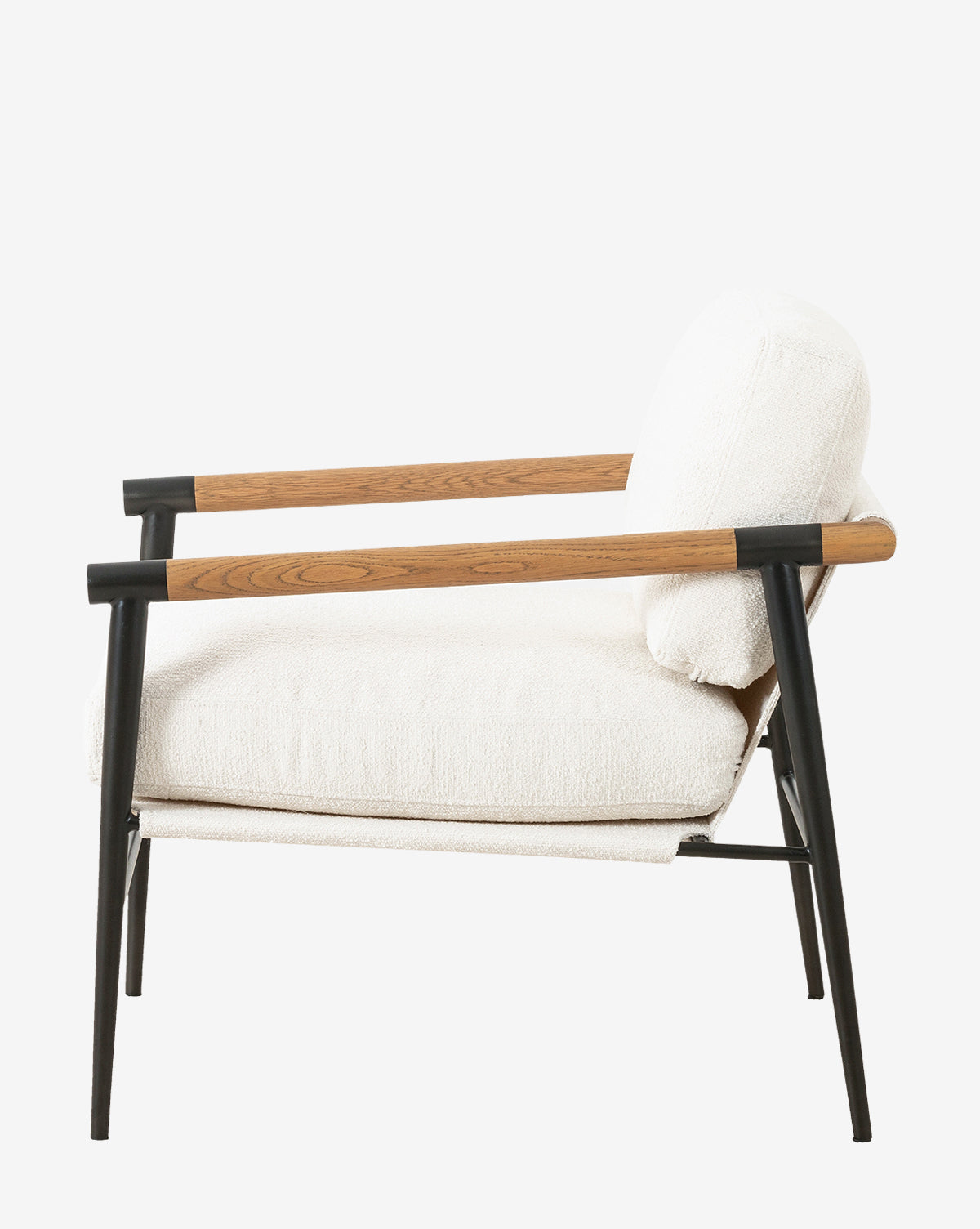 Side view of the Ona Lounge Chair, a modern design with black metal legs, light wood armrests, and white cushioned seat and backrest, shown against a plain white background by McGee & Co.