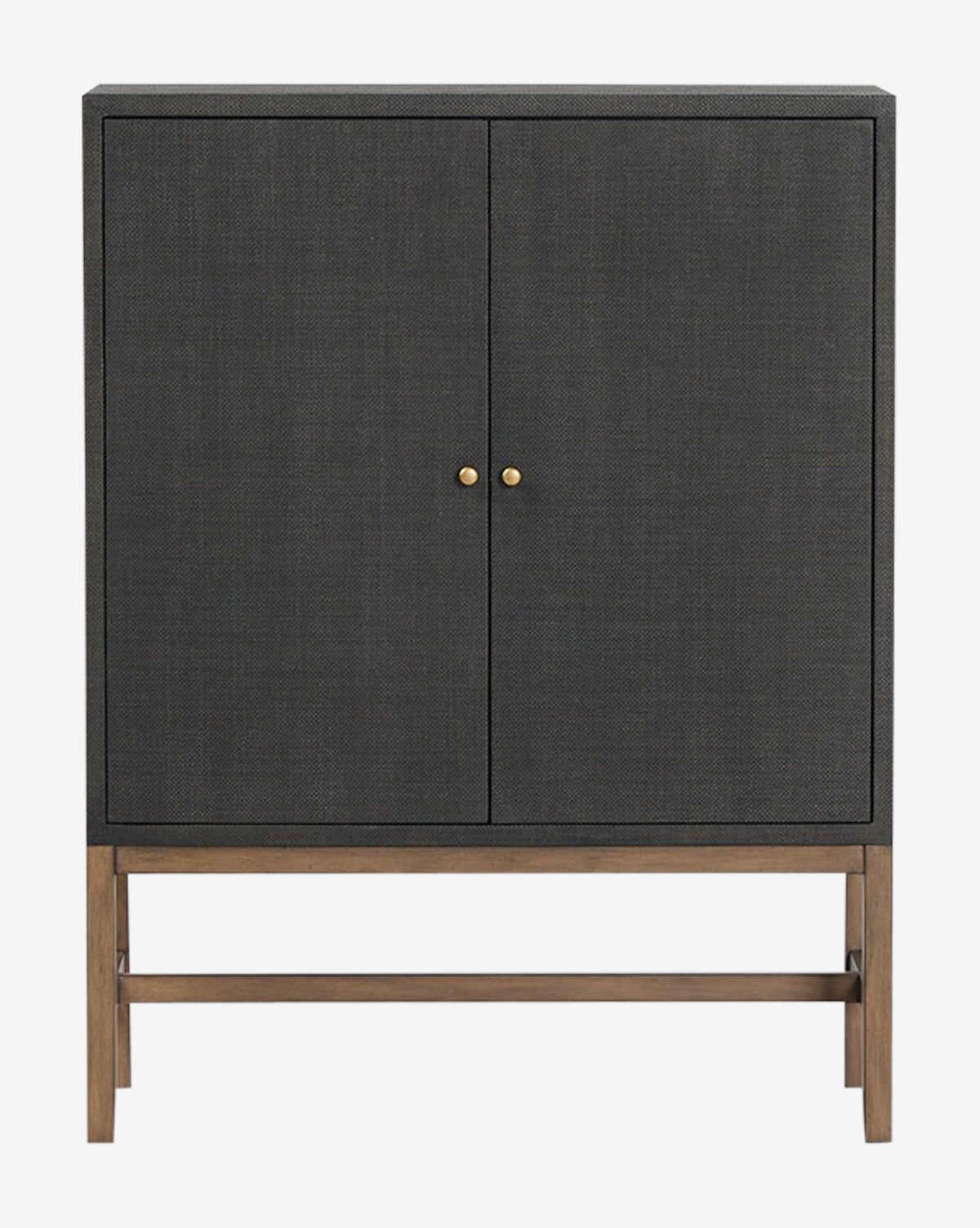 The Osborne Cabinet is a modern black raffia piece featuring two textured dark gray doors, small round gold handles, and a wooden base with clean, straight legs, by McGee & Co.