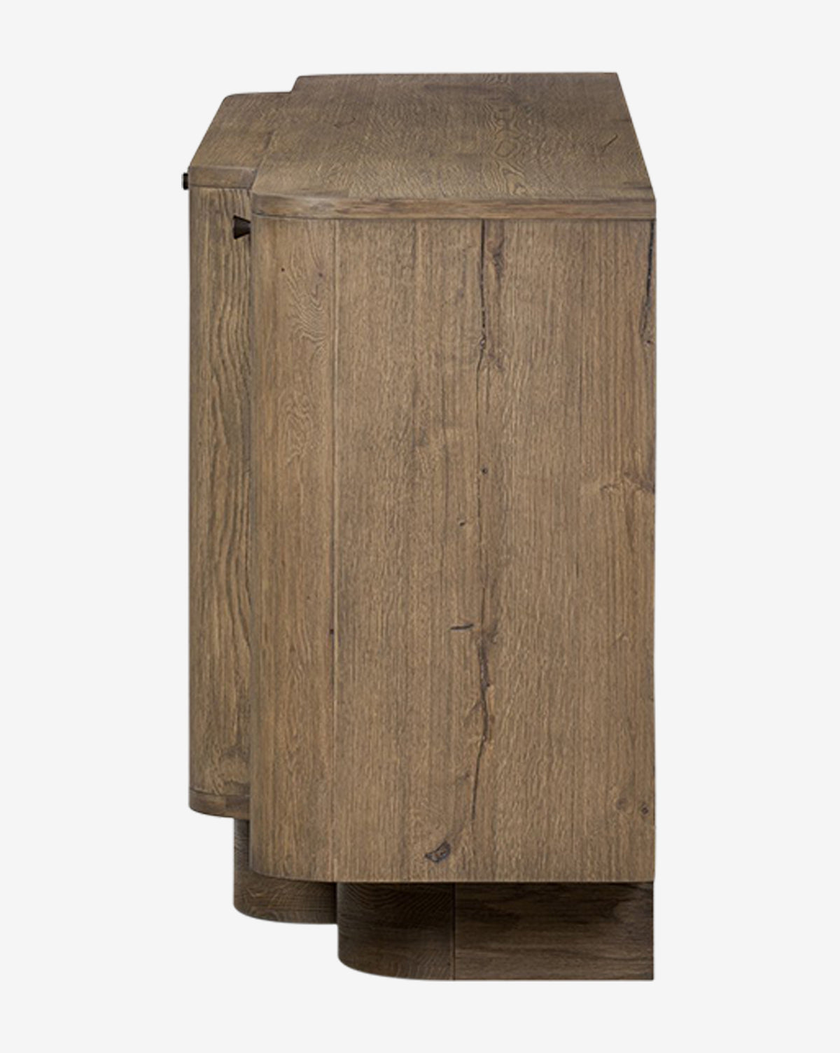 Side view of the Oswin Sideboard, crafted in weathered oak with a natural finish and break-front design. Rounded edges, visible wood grain, and a flat base highlight its sturdy frame and generous storage by McGee & Co.