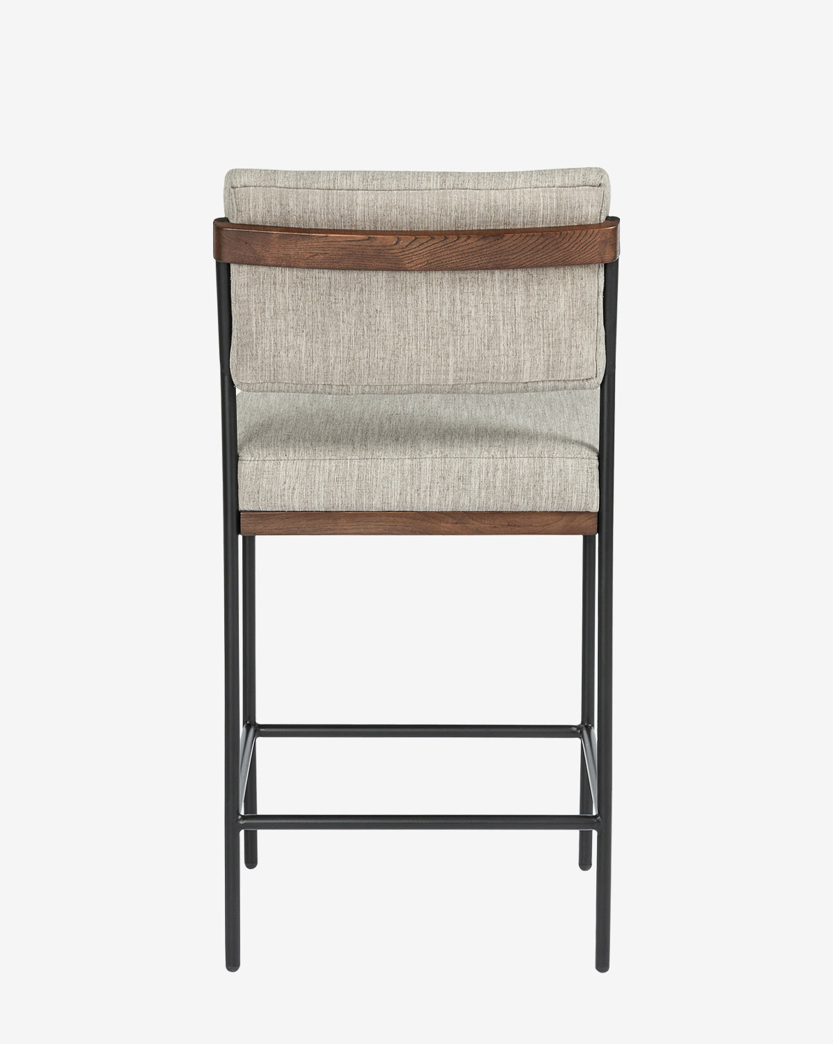 The Pascal Stool showcases a modern design with a black iron frame, wooden backrest, and light beige upholstery on the seat and back, displayed from the rear against a plain white background by McGee & Co.