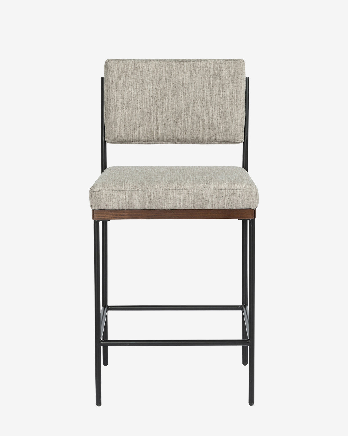 The Pascal Stool combines a light gray upholstered seat and backrest with a black iron frame and footrest, creating a versatile chair for modern spaces, shown against a plain white background by McGee & Co.
