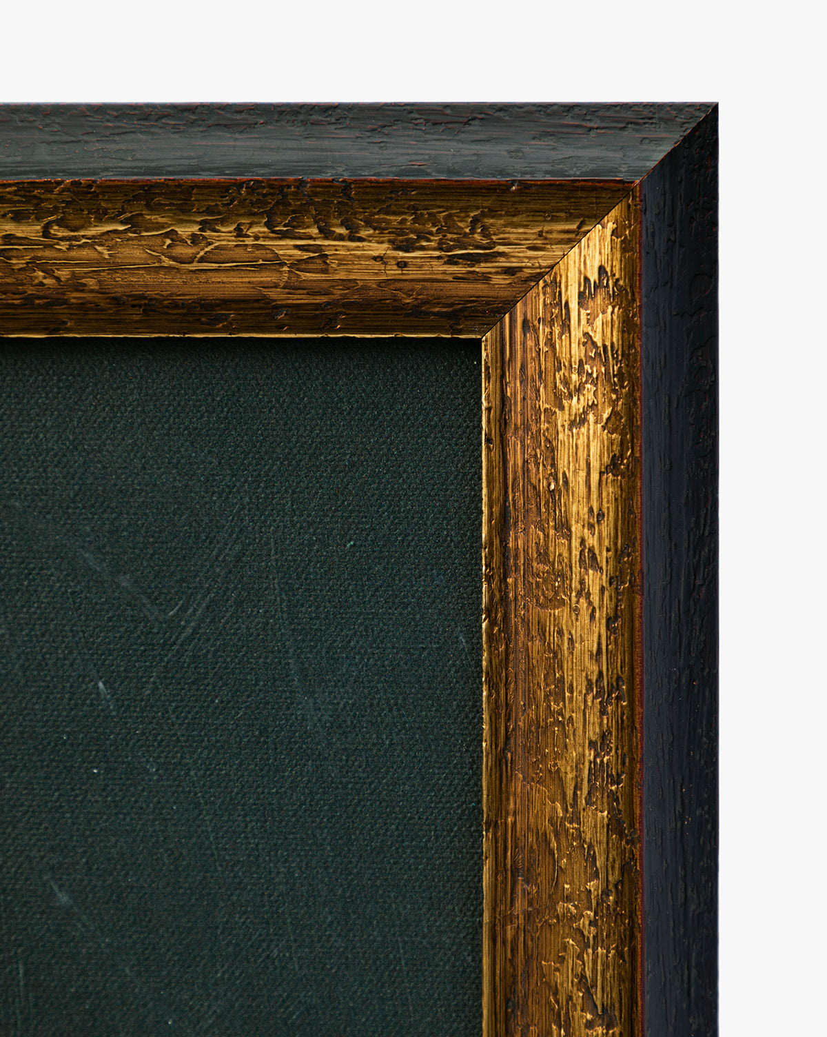 Close-up of a Pear Pictorial frame corner featuring a textured gold inner edge and dark green canvas, ideal for displaying still life or giclee prints. The outer edge is dark with a rough, painted finish, by McGee & Co.