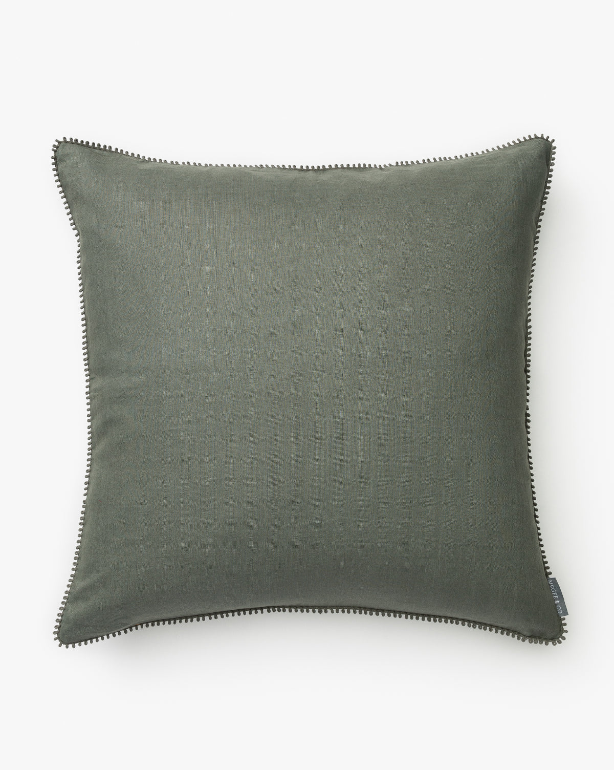 The Pennywood Pillow Cover features olive green linen with a subtle textured fabric and black-and-white piping along the edges, shown against a white background, by McGee & Co.