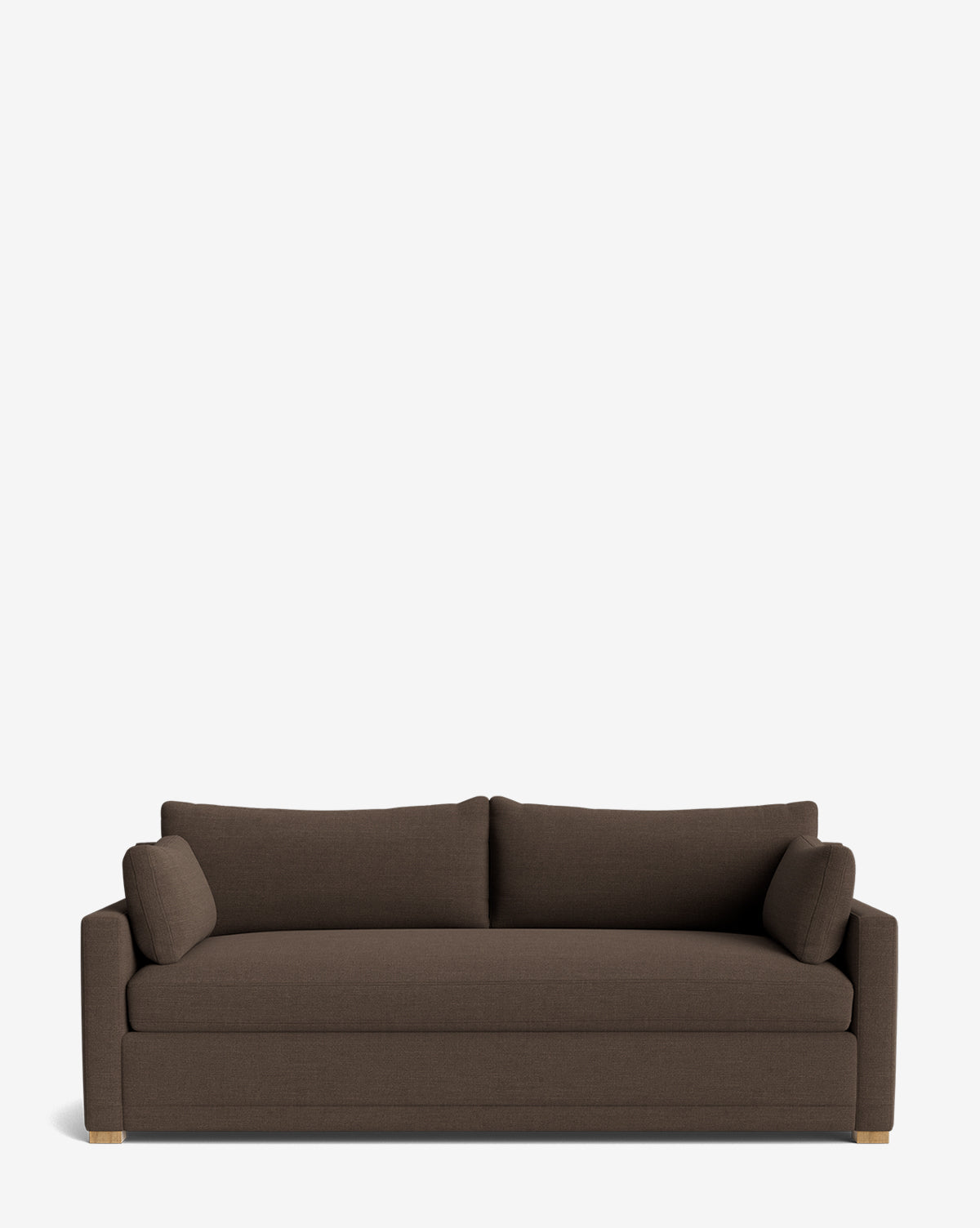 The Peterson Classic Upholstered Sofa (75–100) is a modern, handcrafted dark brown piece featuring clean lines, wooden feet, plush cushions for comfort, and includes two matching cylindrical bolster pillows on each side, by McGee & Co.