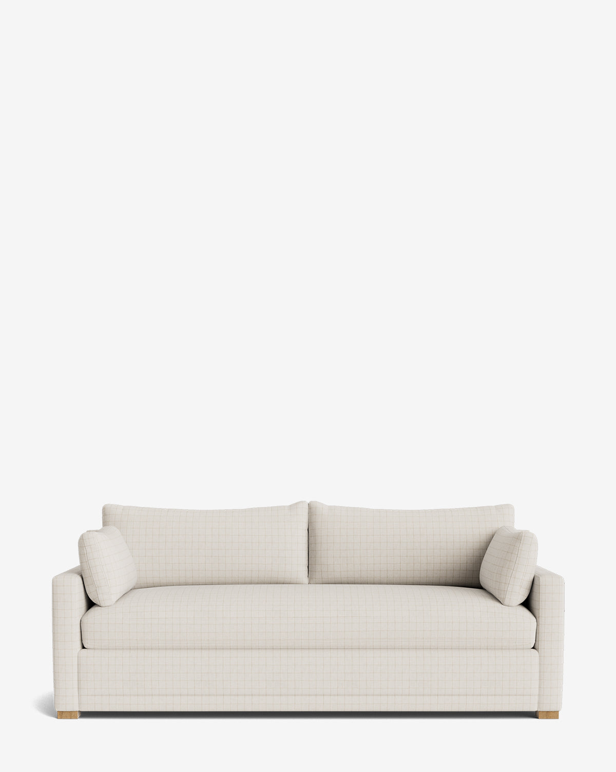 The Peterson Classic Upholstered Sofa (75 - 100) is a modern light beige piece with two plush seat cushions, two backrest cushions, and two small side pillows, shown against a plain white background by McGee & Co.