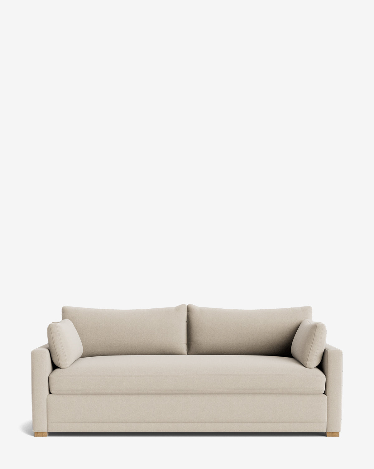 The Peterson Classic Upholstered Sofa (75 - 100) features modern beige upholstery, clean lines, two plush seat cushions, two back cushions, and matching bolster pillows set against a plain white background by McGee & Co.