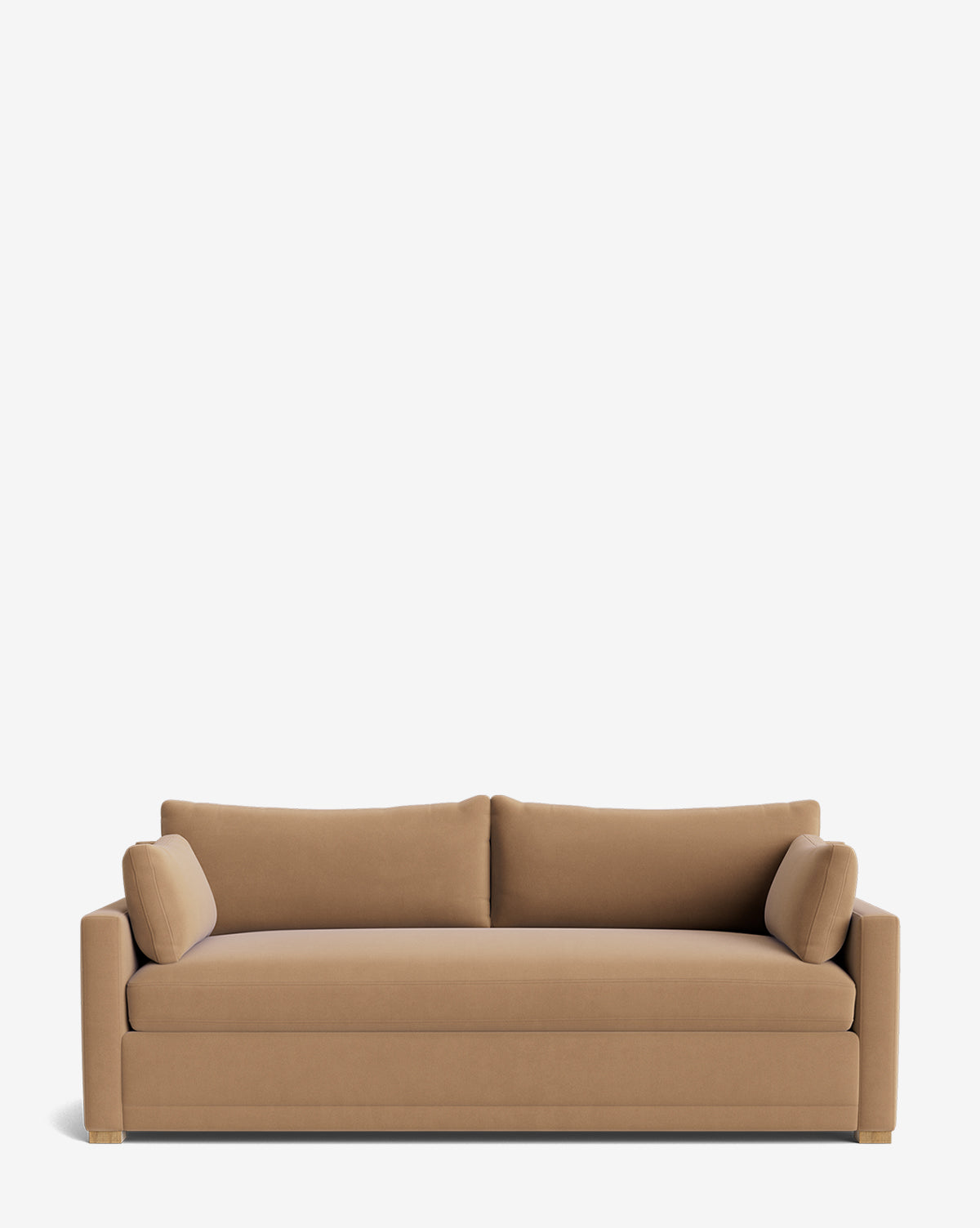 The Peterson Classic Upholstered Sofa (75 - 100) features tan upholstery, clean modern lines, two plush seat and back cushions, two bolster pillows, low square arms, and short square legs against a white background by McGee & Co.