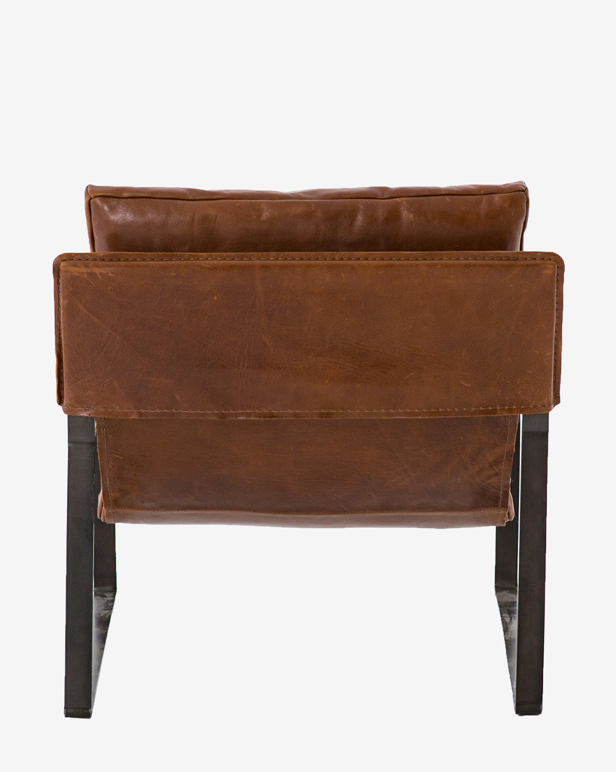 The Peyton Leather Sling Chair is a modern design with black metal legs, shown from the back on a plain white background. It has a wide, cushioned seat and backrest, both featuring visible stitching for style.