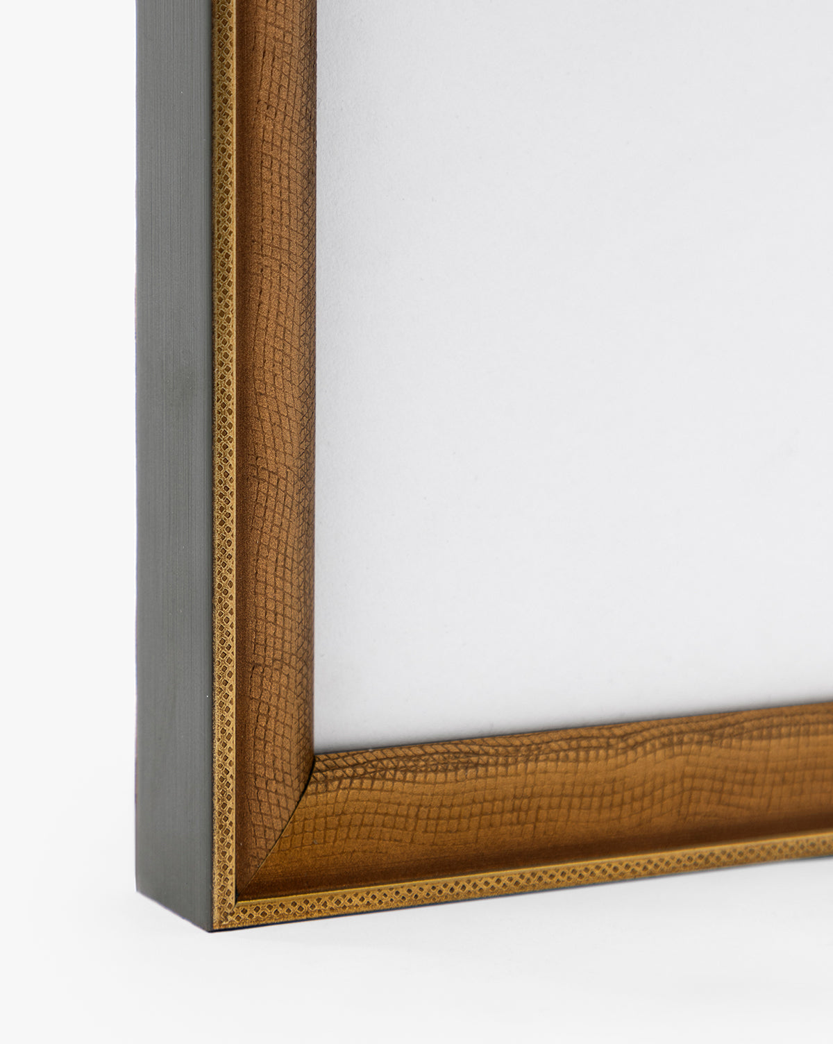Close-up of the corner of a Post Card Address frame, featuring a gold-finished wood design with a textured golden inner edge and smooth brown outer edge, set against a plain white background by McGee & Co.