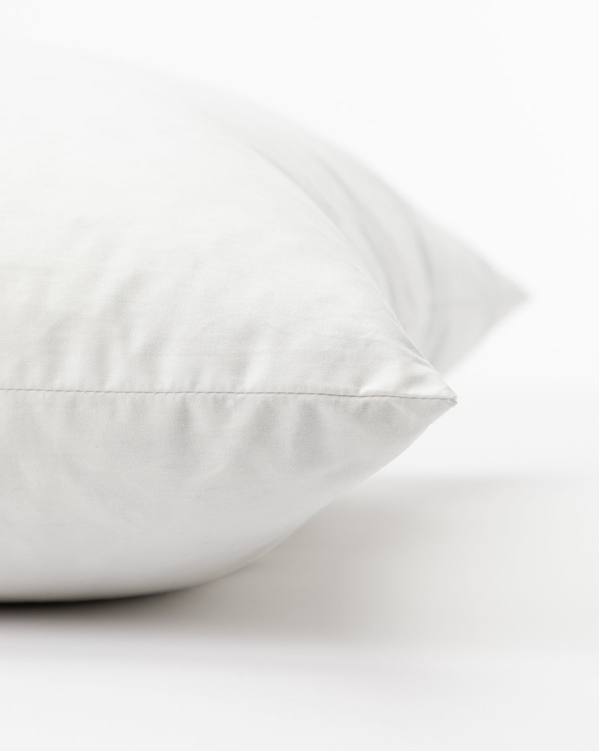 Down pillow insert detail with cotton covering from McGee & Co.
