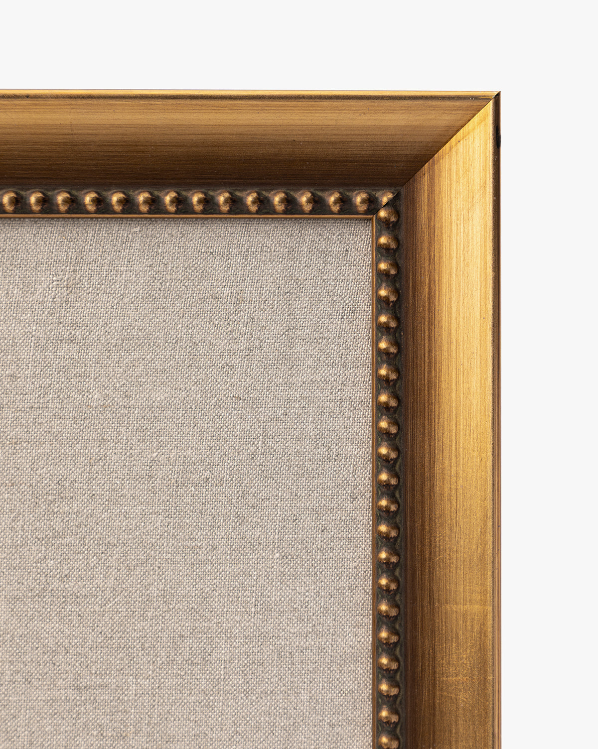 Close-up of the top right corner of a gold frame with beaded detail and a beige fabric background, showcasing Purple Irises in Vases—an elegant art piece for sophisticated home decor, by McGee & Co.