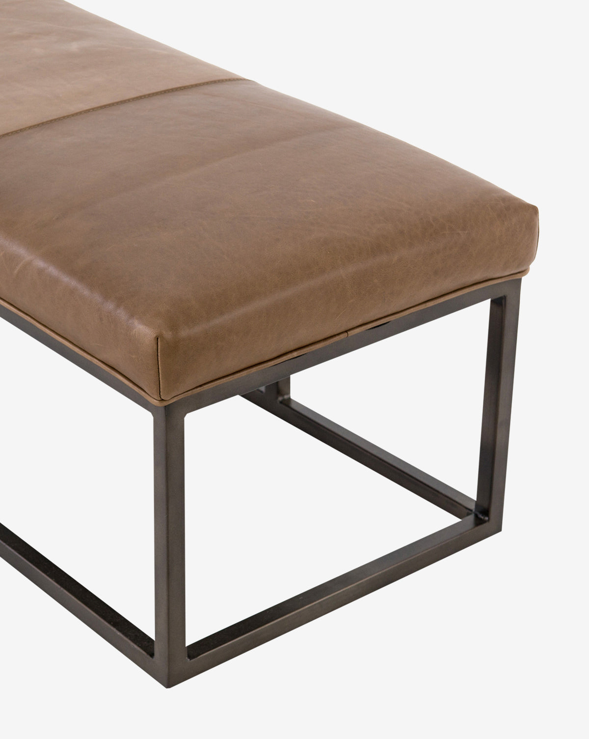 The Quincy Bench features a rectangular taupe leather seat and sleek black iron frame, shown close-up against a white background by McGee & Co.