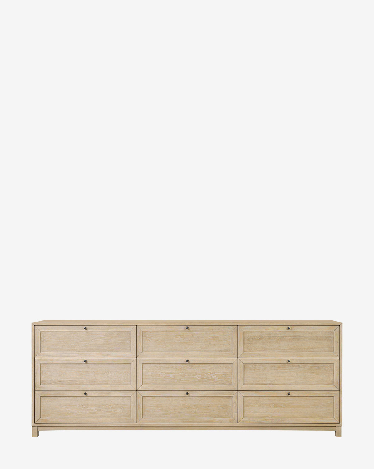 The Raine 9 Drawer Dresser, featuring a large build in light oak and small dark metal handles, stands against a plain white background. This STURDY Act compliant piece combines modern style with practical functionality by McGee & Co.