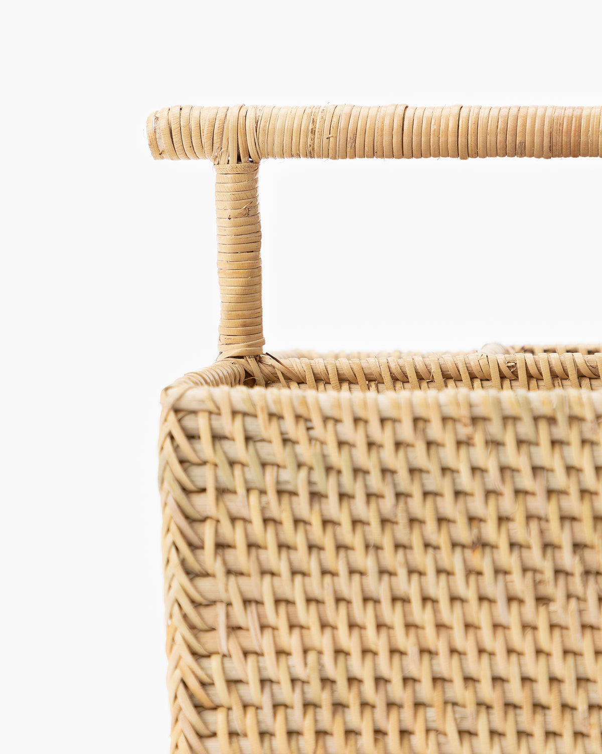 Close-up of the Rattan Utensil Caddy, featuring a rectangular woven design and sturdy handle, ideal as an organizer, displayed against a plain white background, by McGee & Co.