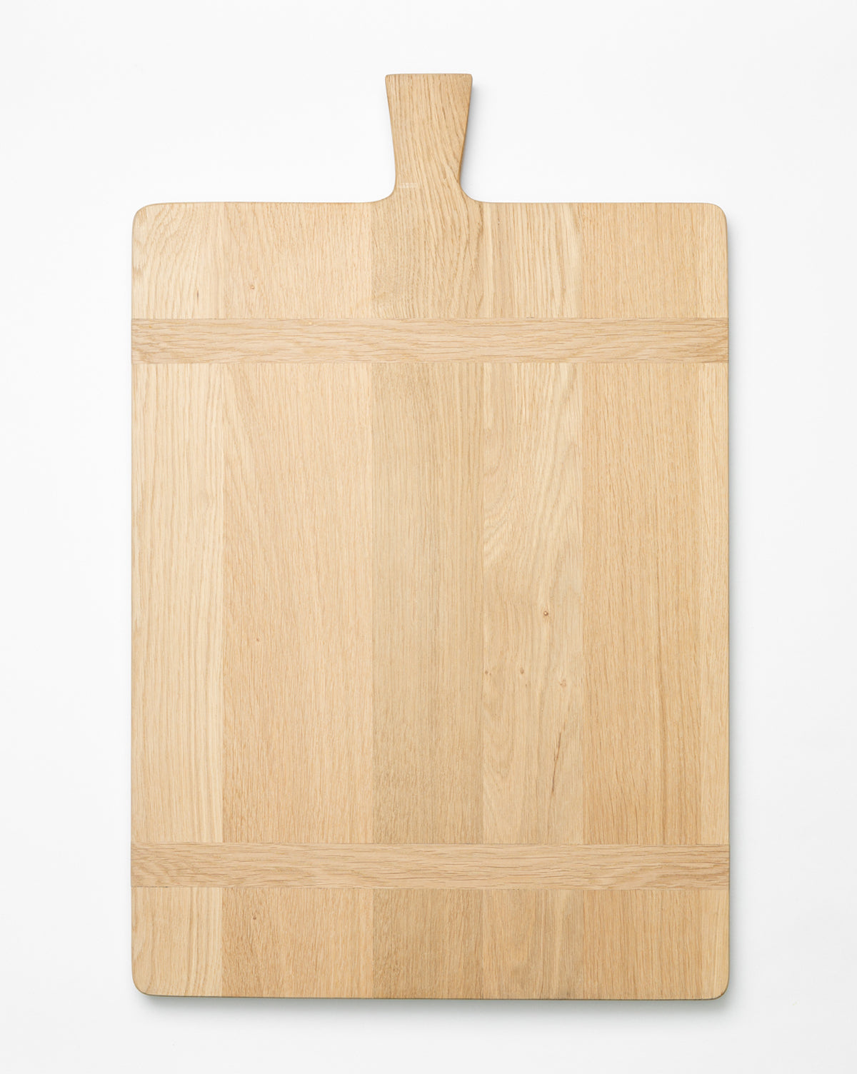 The Rectangle Bread Board, made from oak and walnut with a natural finish and short top handle, showcases beautiful grain patterns against a plain white background, by McGee & Co.