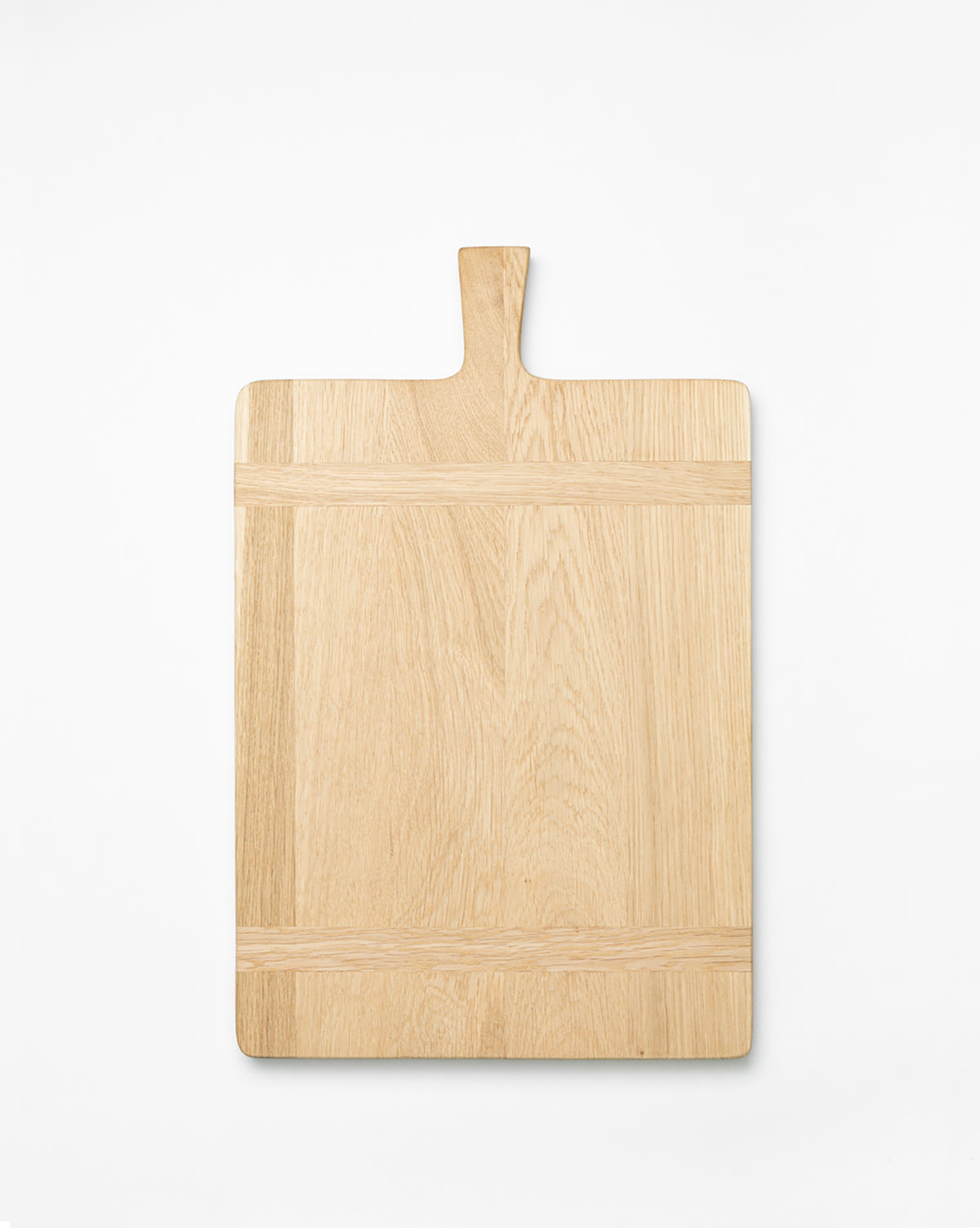 The Rectangle Bread Board, made from oak and walnut with a handle, features a natural finish that showcases the wood grain and clean lines. It is photographed on a white background by McGee & Co.