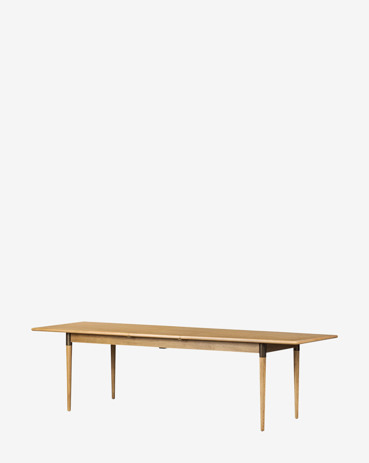 The Redmond Extension Dining Table is a long, rectangular wooden table with four tapered legs and a minimalist Scandinavian design—perfect for modern dining rooms, by McGee & Co. Shown on a plain white background.