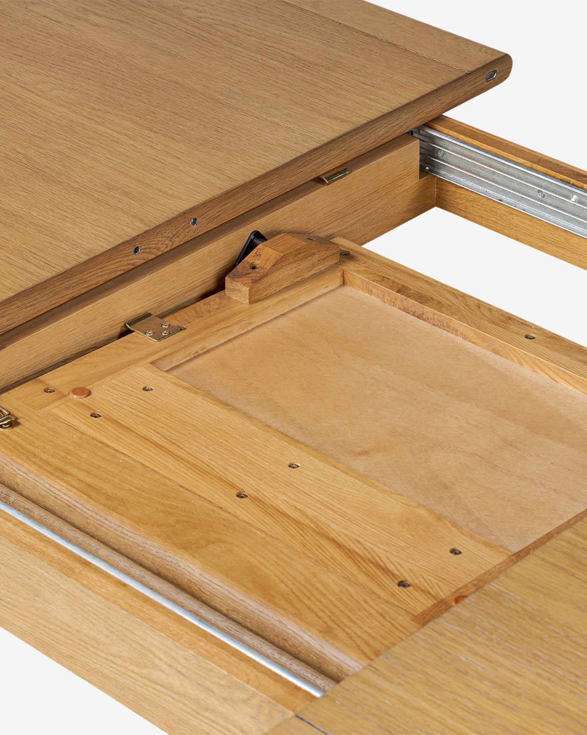 Close-up of the Redmond Extension Dining Tables mechanism, featuring sliding metal rails and hidden compartments for easy table extension or collapse—a sleek Scandinavian-inspired addition to any dining room, by McGee & Co.