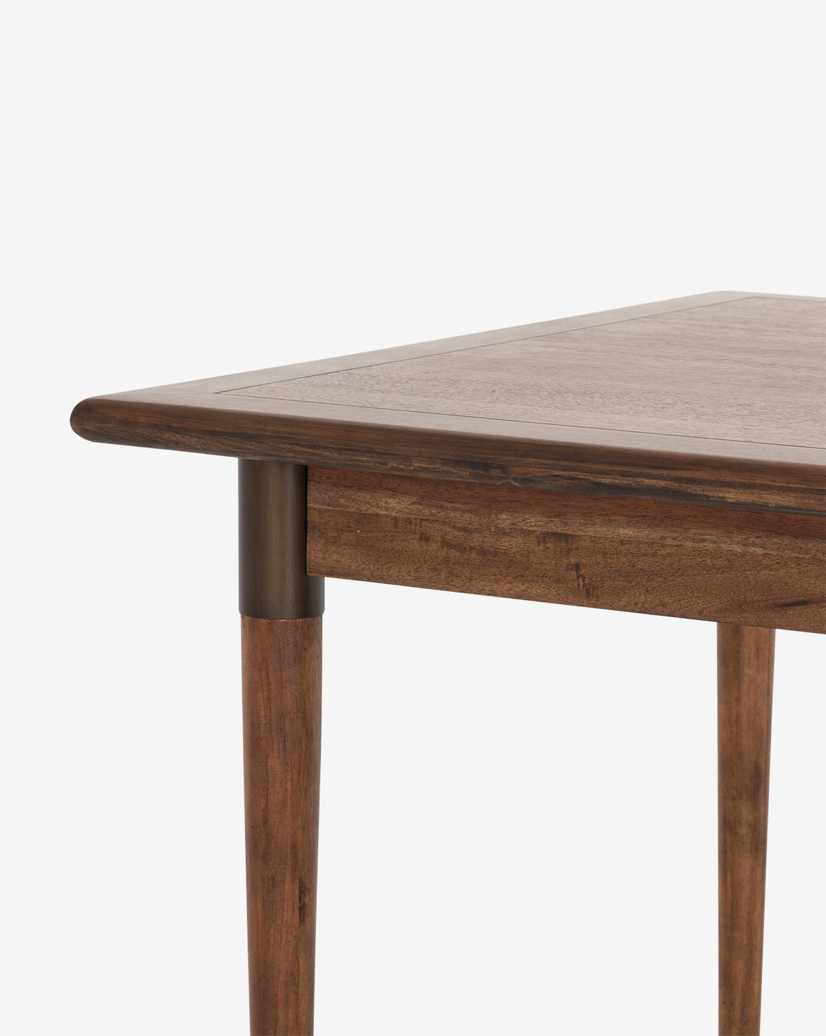 Close-up of the Redmond Extension Dining Table, showcasing its Scandinavian-inspired smooth wooden finish, rounded tabletop edges, and cylindrical tapered legs. Set against a plain white background to emphasize its modern dining room style by McGee & Co.