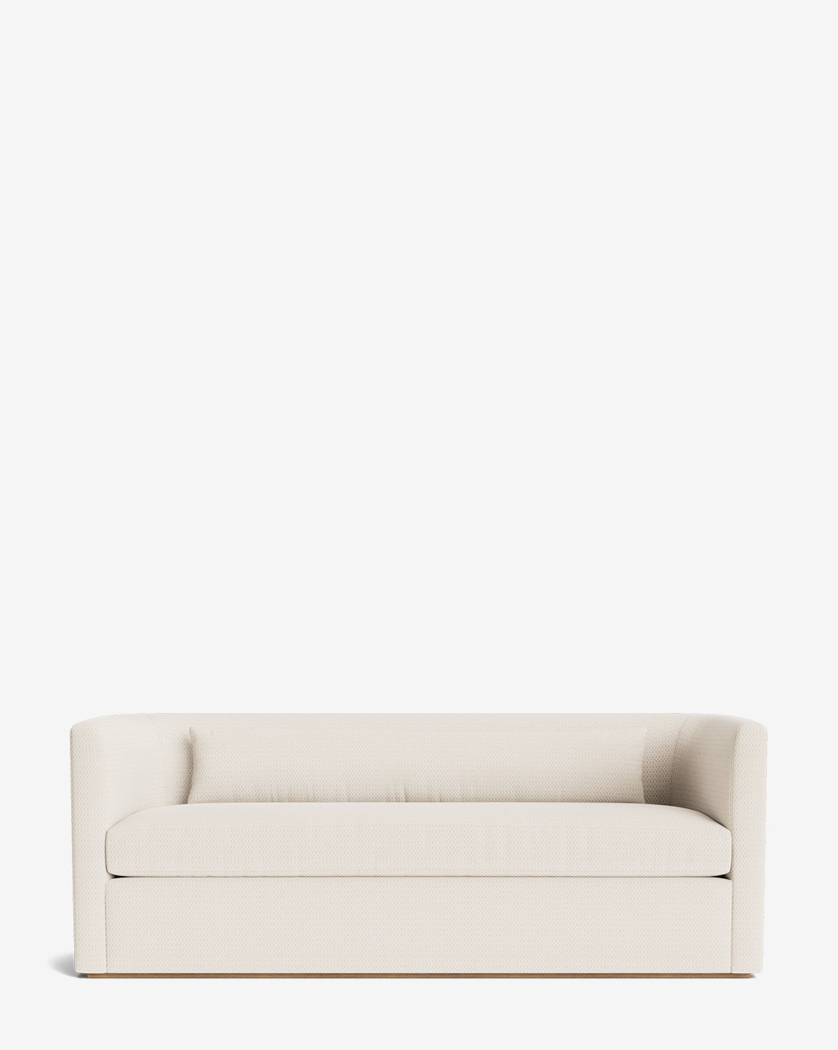 The Reese Sofa (84-96) showcases a modern, minimalist look with off-white upholstery, rounded arms, and a low back. Handcrafted alder wood frame and down-wrapped cushions provide both durability and comfort against a white backdrop, by McGee & Co.