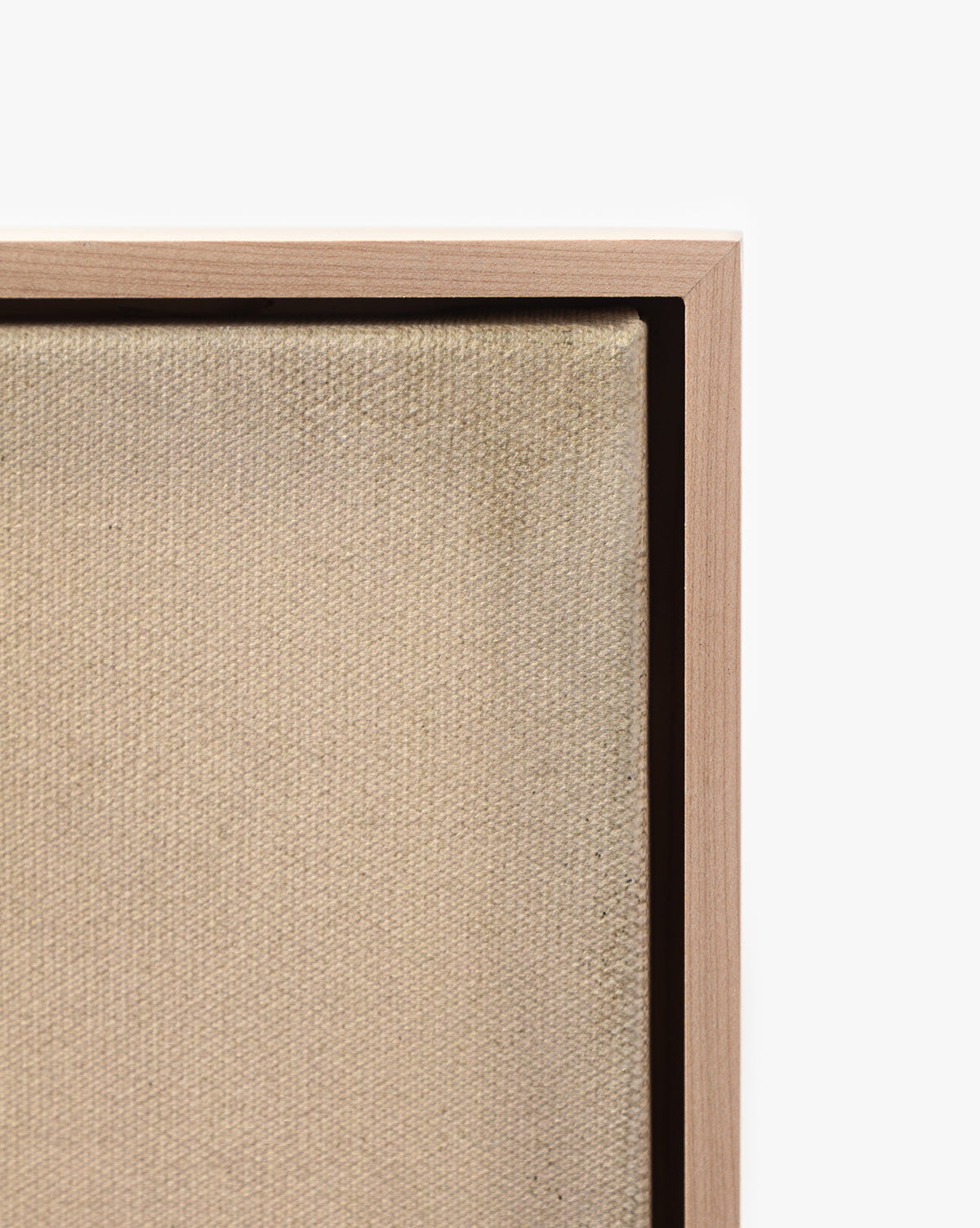 Close-up of the corner of Restored by Brittany Schulz, a museum-quality canvas in a light wooden frame, set against a plain white background, by McGee & Co.